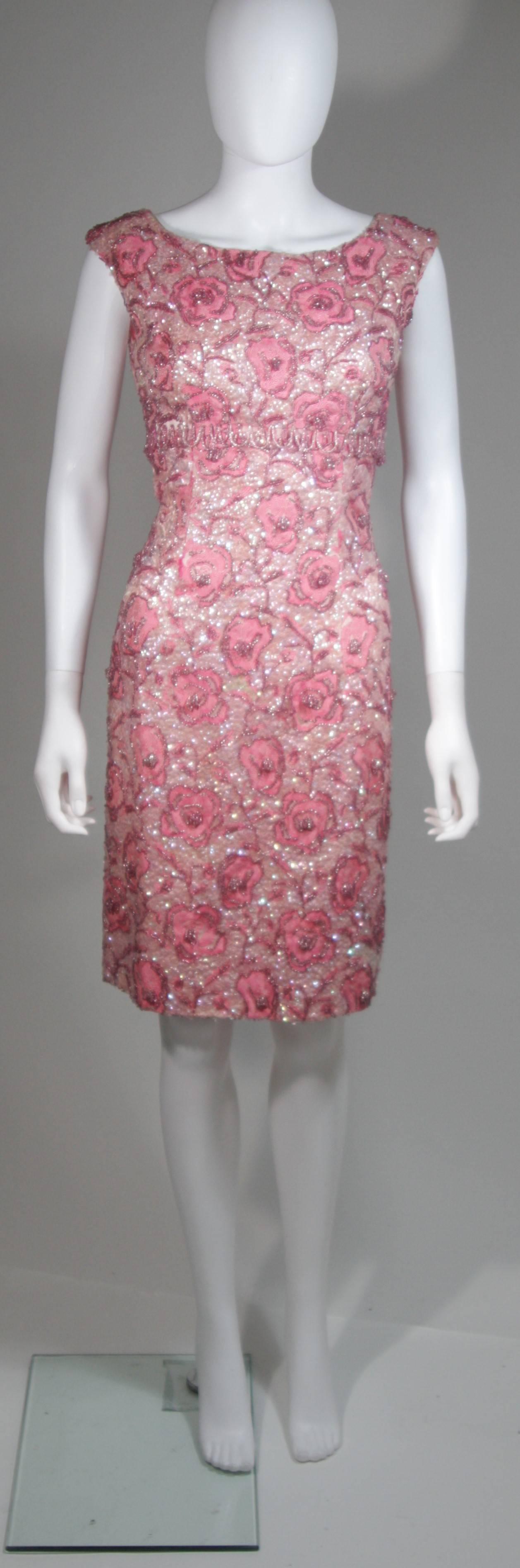 This vintage cocktail dress is composed of a pink floral brocade fabric embellished with sequins and beading. There is a center back zipper closure. In excellent vintage condition. 

**Please cross-reference measurements for personal accuracy.