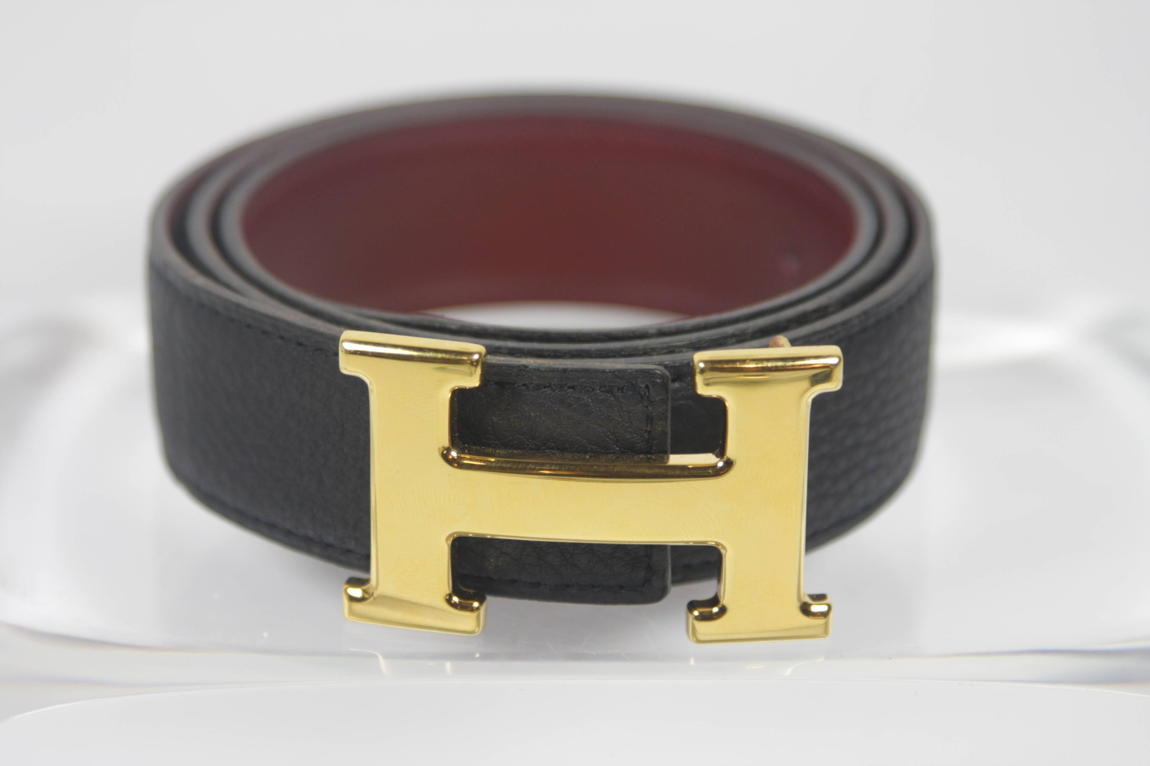 This Hermes design is available for viewing at our Beverly Hills Boutique. We offer a large selection of evening gowns and luxury garments. 

 This Hermes Constance belt is reversible with the color options of Ink & Rouge Hermes (deep blue black