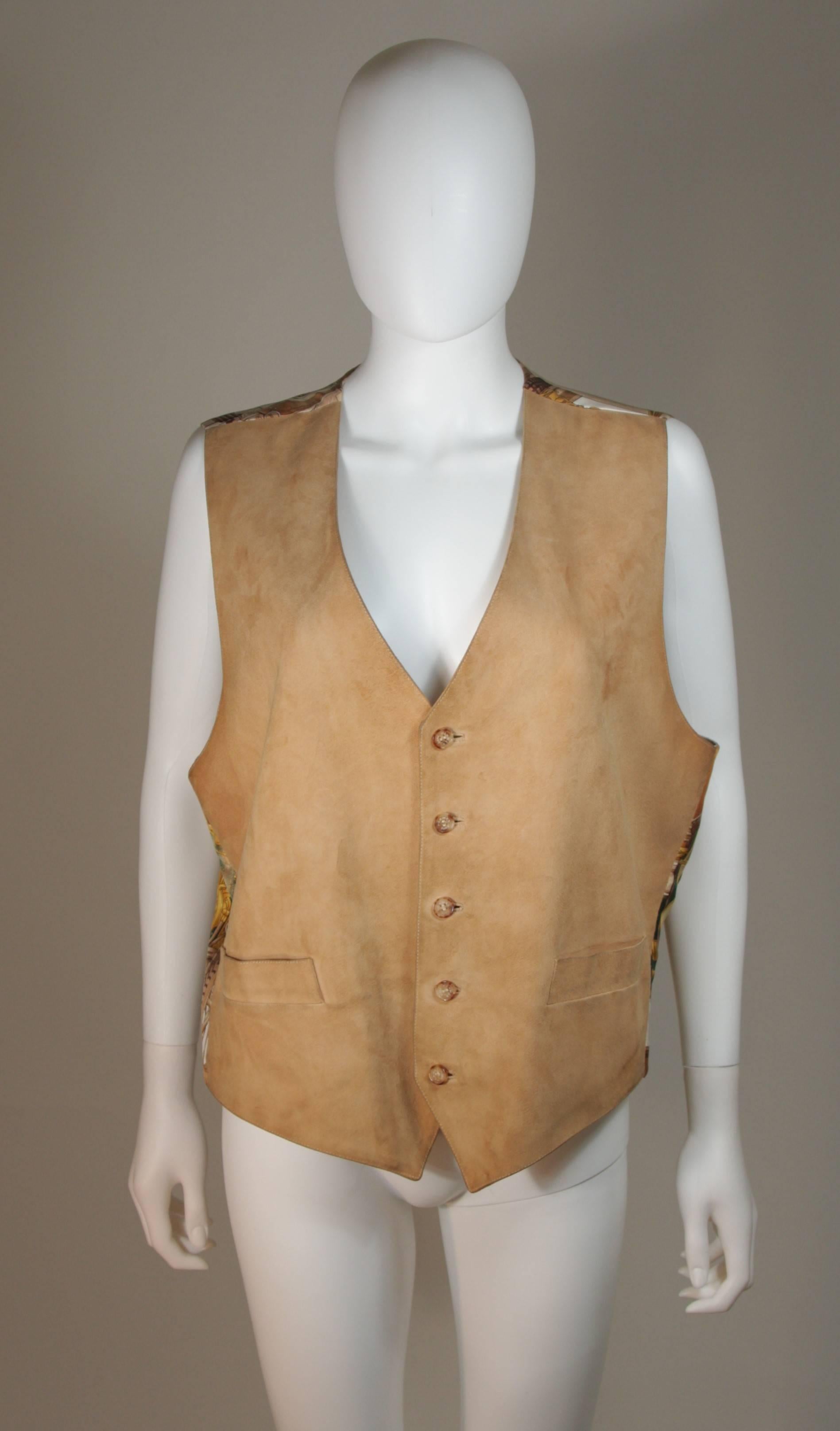  This Hermes design is available for viewing at our Beverly Hills Boutique. We offer a large selection of evening gowns and luxury garments. 

 This vest is composed a natural color suede front and a printed silk back. There are front pockets and