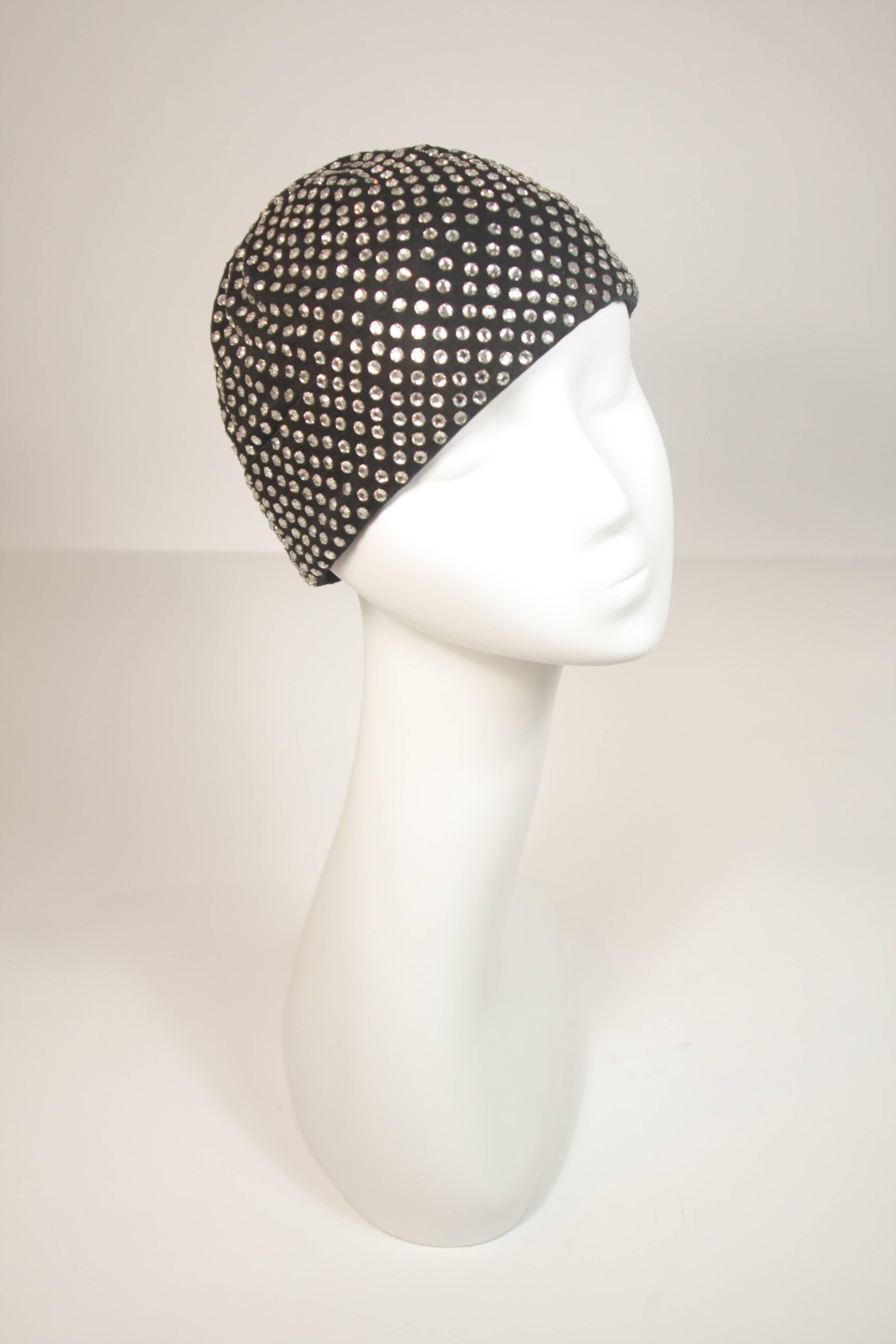 This Frank Olive hat is composed of a black jersey and features rhinestones throughout. In excellent condition.

  **Please cross-reference measurements for personal accuracy. 

Measurements (Approximately)  
Circumference: 24.25