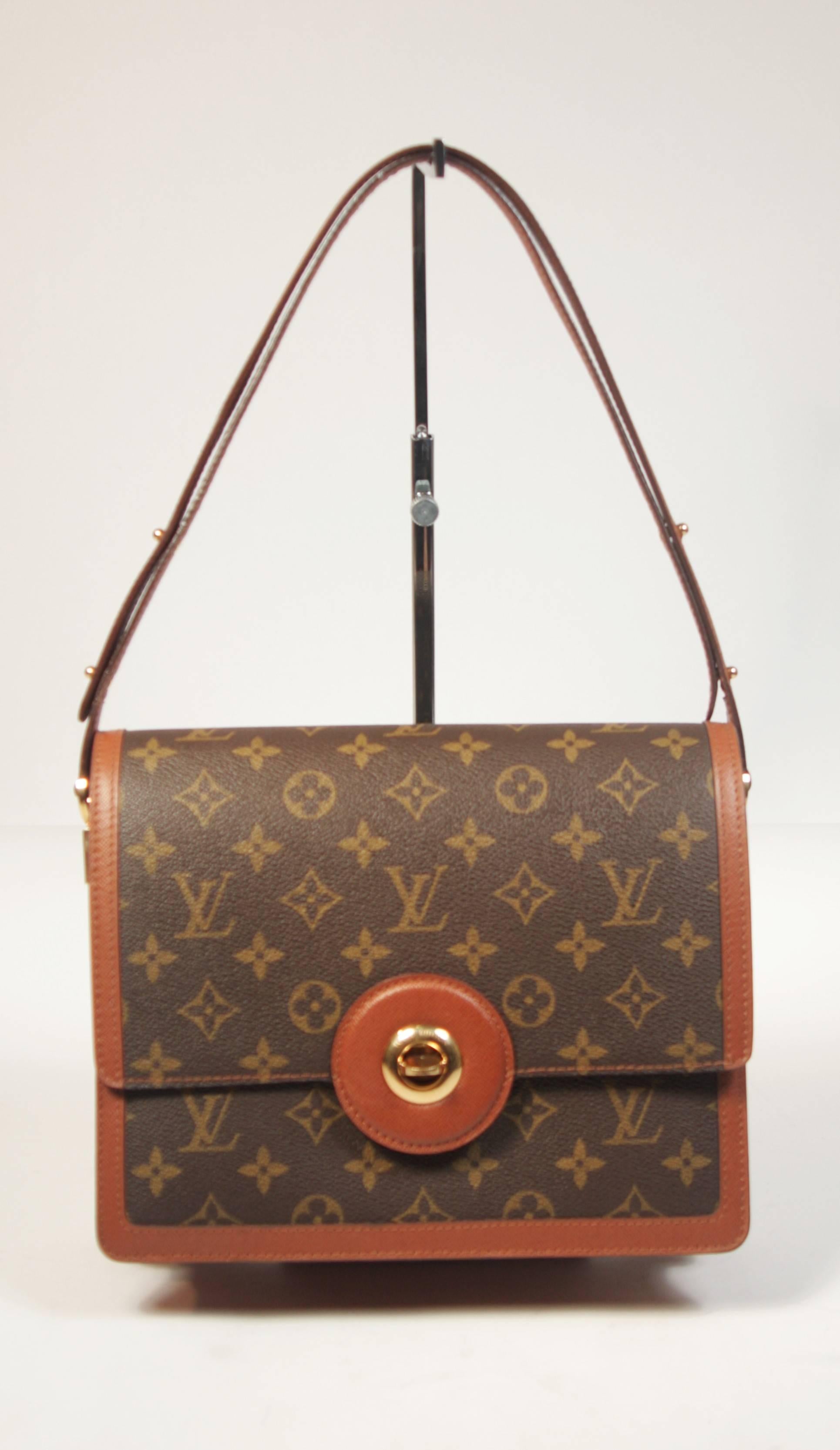 This Louis Vuitton design is available for viewing at our Beverly Hills Boutique. We offer a large selection of evening gowns and luxury garments. 

 This handbag is composed of the classic Louis Vuitton monogram print and features a rich cognac