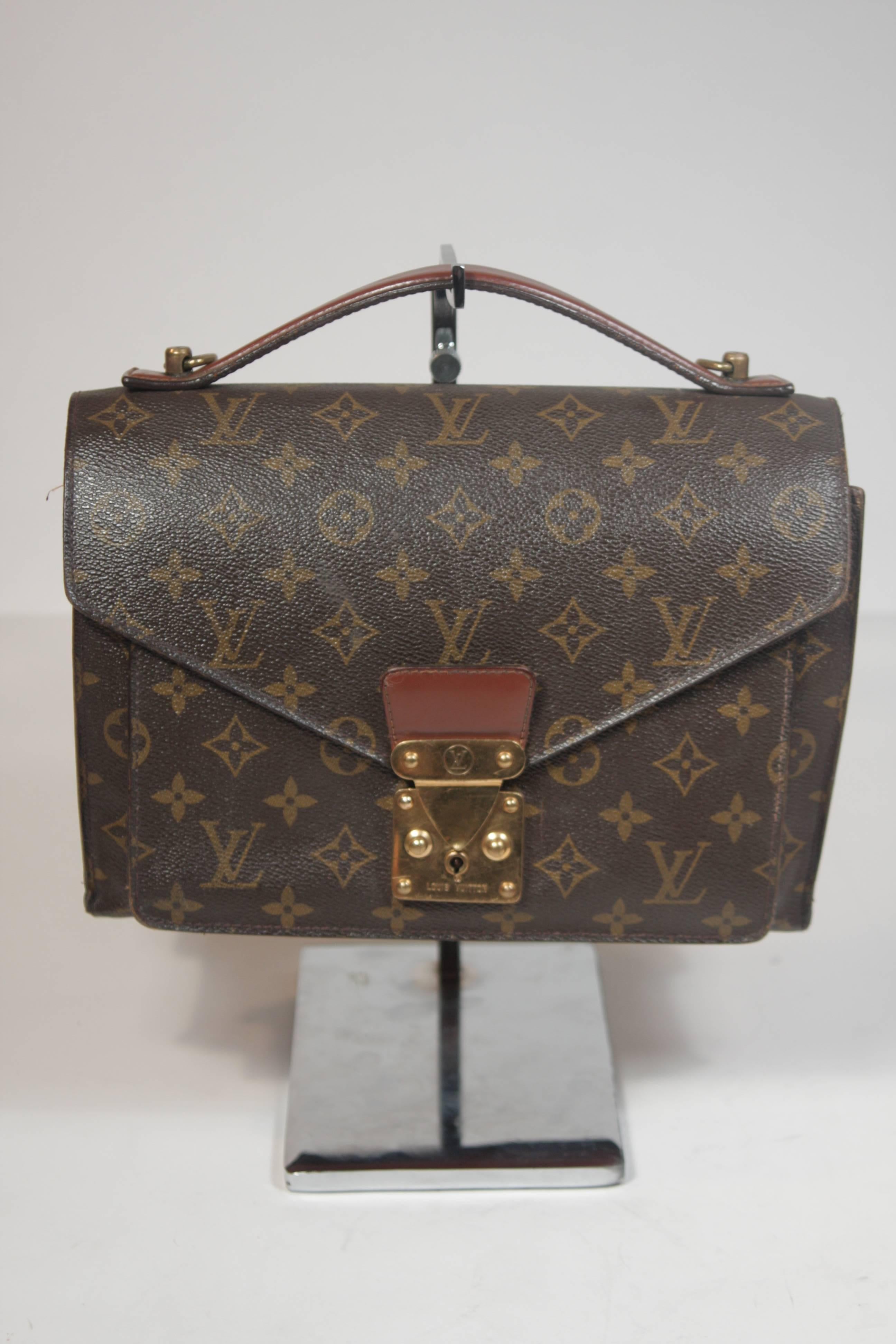 This Louis Vuitton design is available for viewing at our Beverly Hills Boutique. We offer a large selection of evening gowns and luxury garments. 

 This handbag features the classic monogram canvas print with leather trim. There is an optional