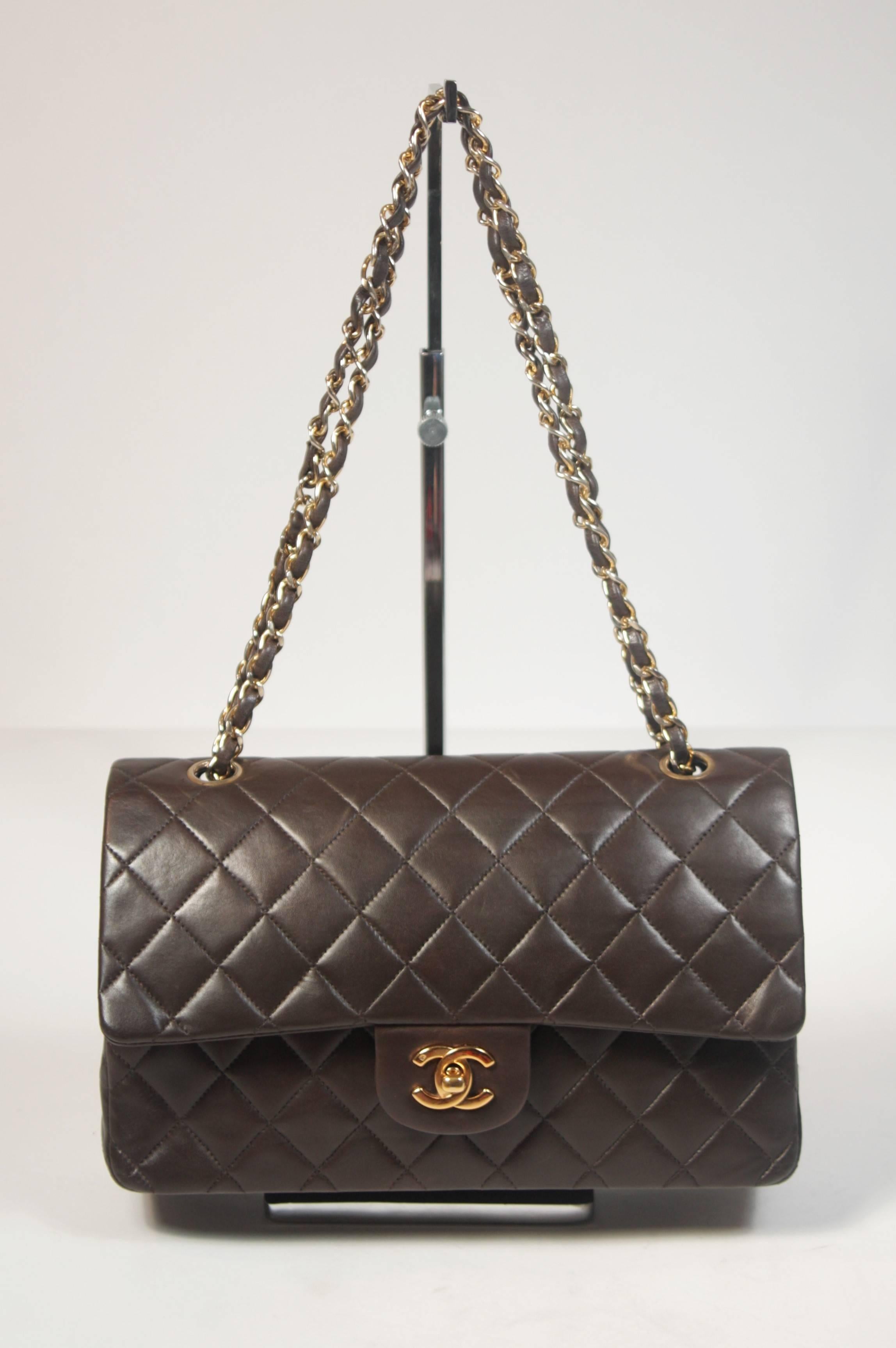 This Chanel design is available for viewing at our Beverly Hills Boutique. We offer a large selection of evening gowns and luxury garments. 

 This handbag is composed of a chocolate quilted lambskin leather with Chanel's signature diamond