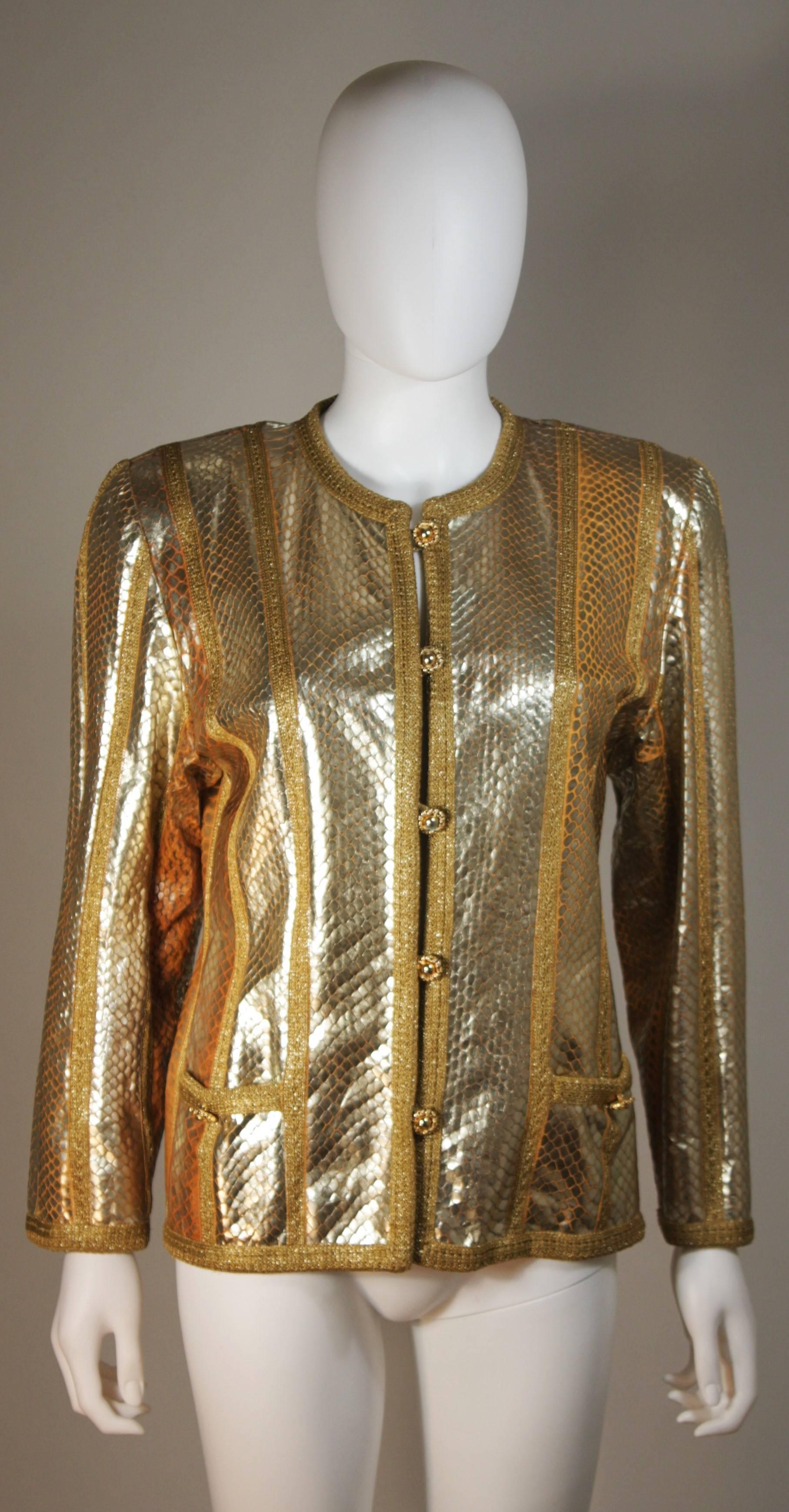 This Amen Wardy jacket is composed of a foiled snakeskin in a gold metallic hue. There are gold hued button closures at the center front. In excellent condition.

  **Please cross-reference measurements for personal accuracy. Size in description