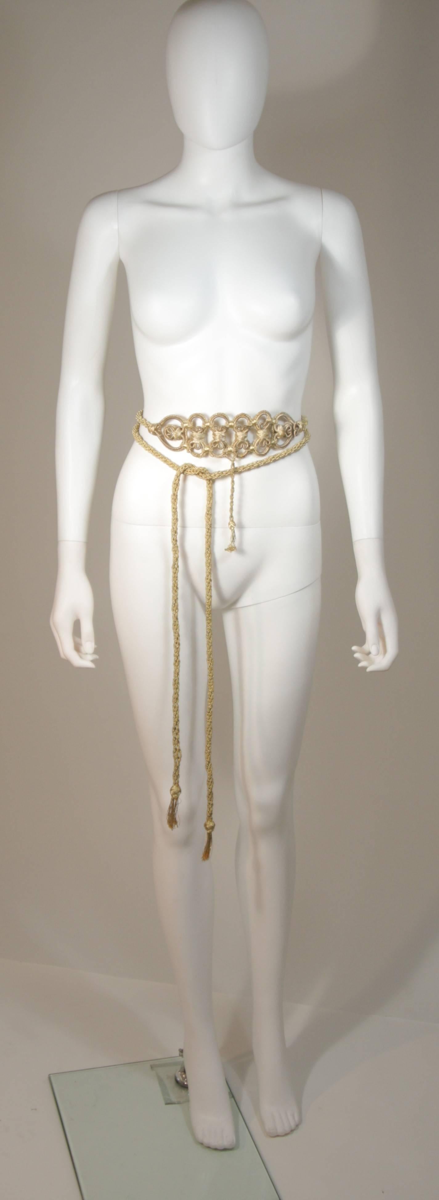 This Oscar De La Renta belt is composed of a braided gold metallic material and features a tassel style. In excellent condition. 

  **Please cross-reference measurements for personal accuracy. 

Measurements (Approximately)  
Dimensions 
Each