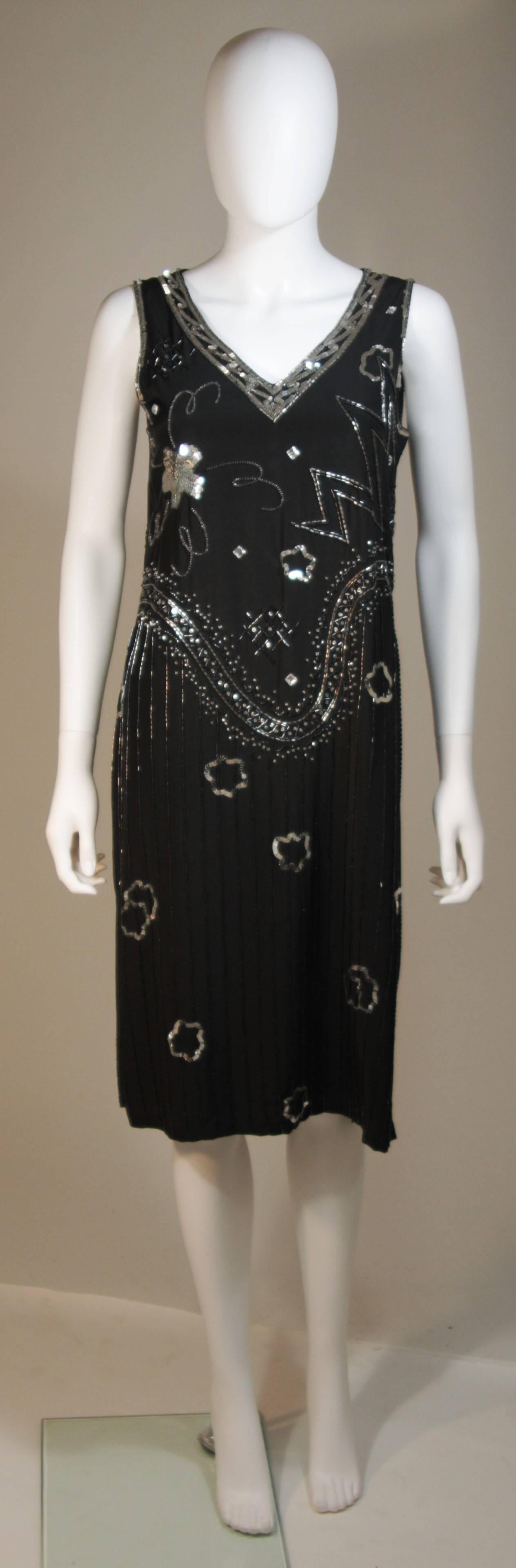 This Giorgio Beverly Hills dress is composed of a sequin embellished silk chiffon. This deco inspired dress features a side zipper closure. In excellent condition. 

  **Please cross-reference measurements for personal accuracy. 

Measurements