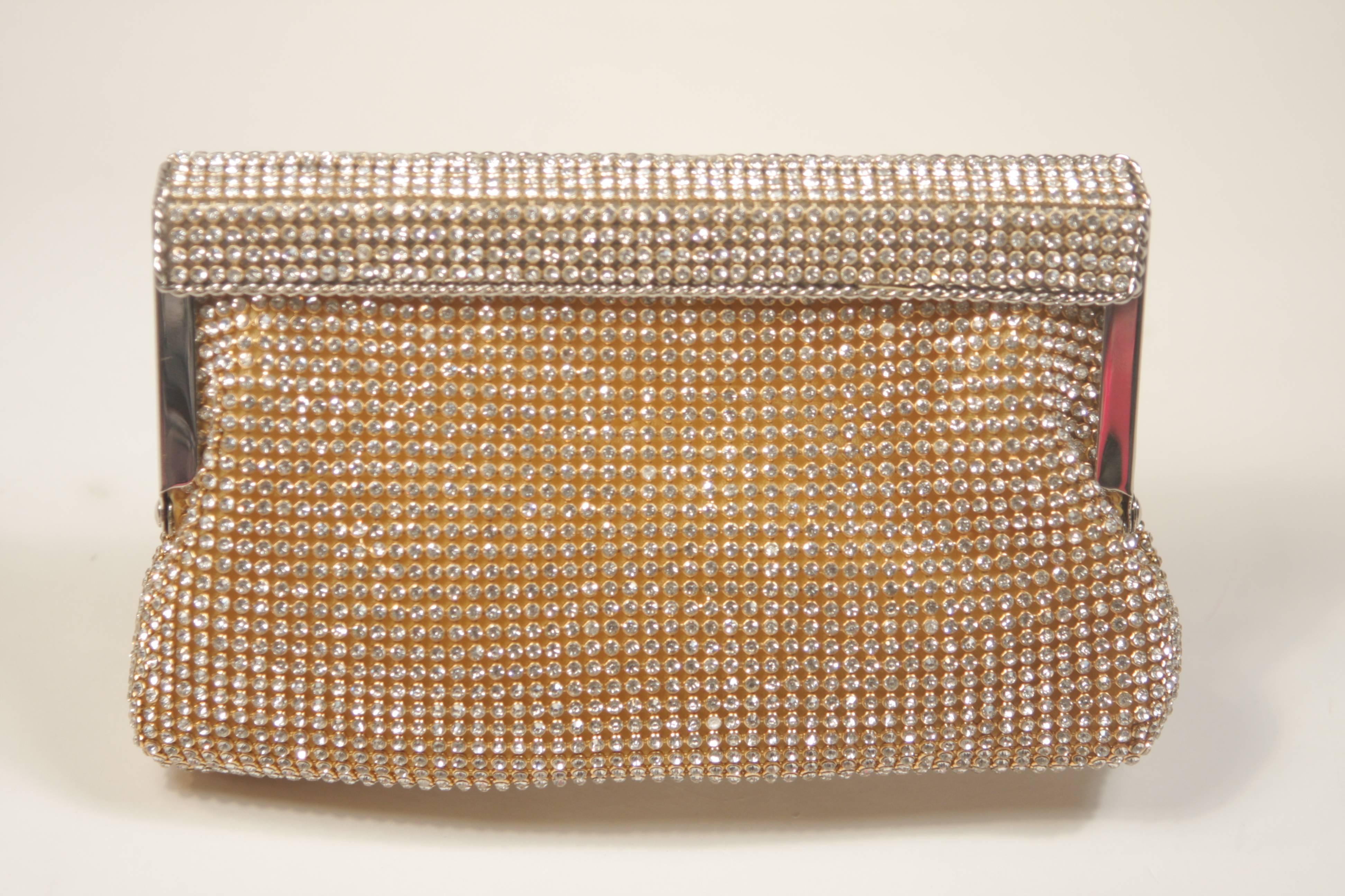  This Elizabeth Mason Couture  rhinestone clutch features a frame style. There is an optional strap. Also available in black as well. In new or unused condition.

  **Please cross-reference measurements for personal accuracy. 

Measurements