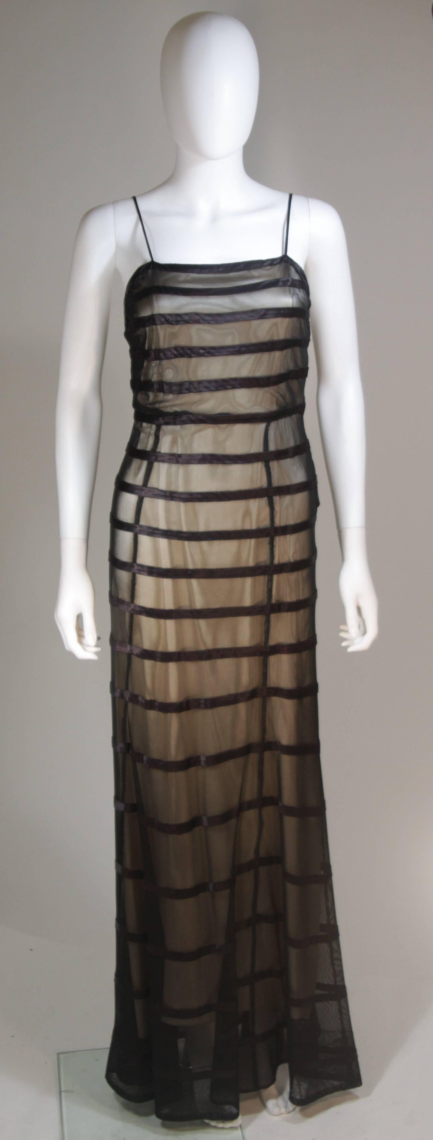  This 1930's  gown is composed of a sheer mesh fabric with silk accents and nude slip. There are snap closures. In excellent vintage condition.

  **Please cross-reference measurements for personal accuracy. Size in description box is an