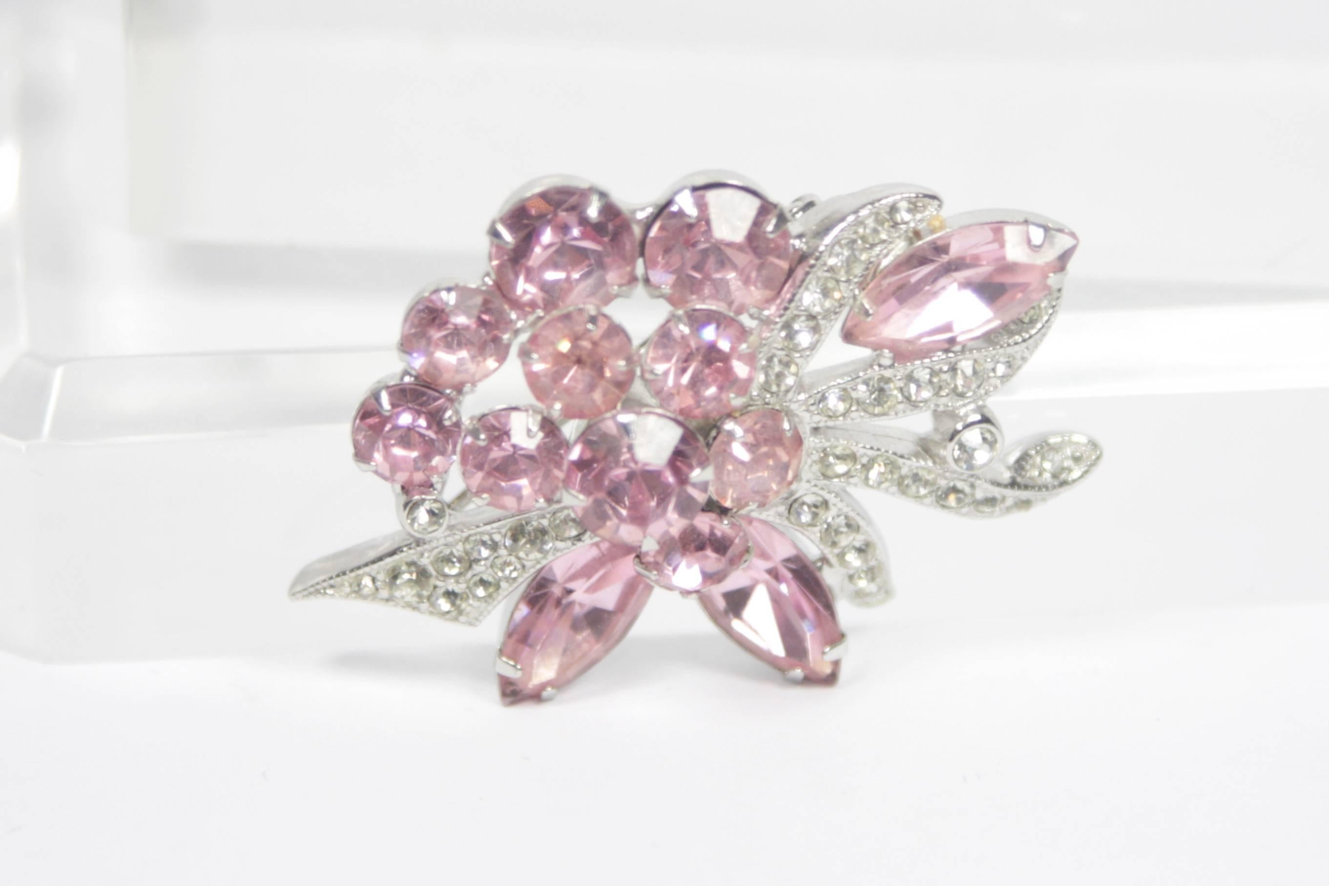 This Eisenberg  brooch features a floral design with pink and white rhinestones set in a white gold hued metal. A lovely piece in excellent vintage condition. 

  **Please cross-reference measurements for personal accuracy. 

Measures