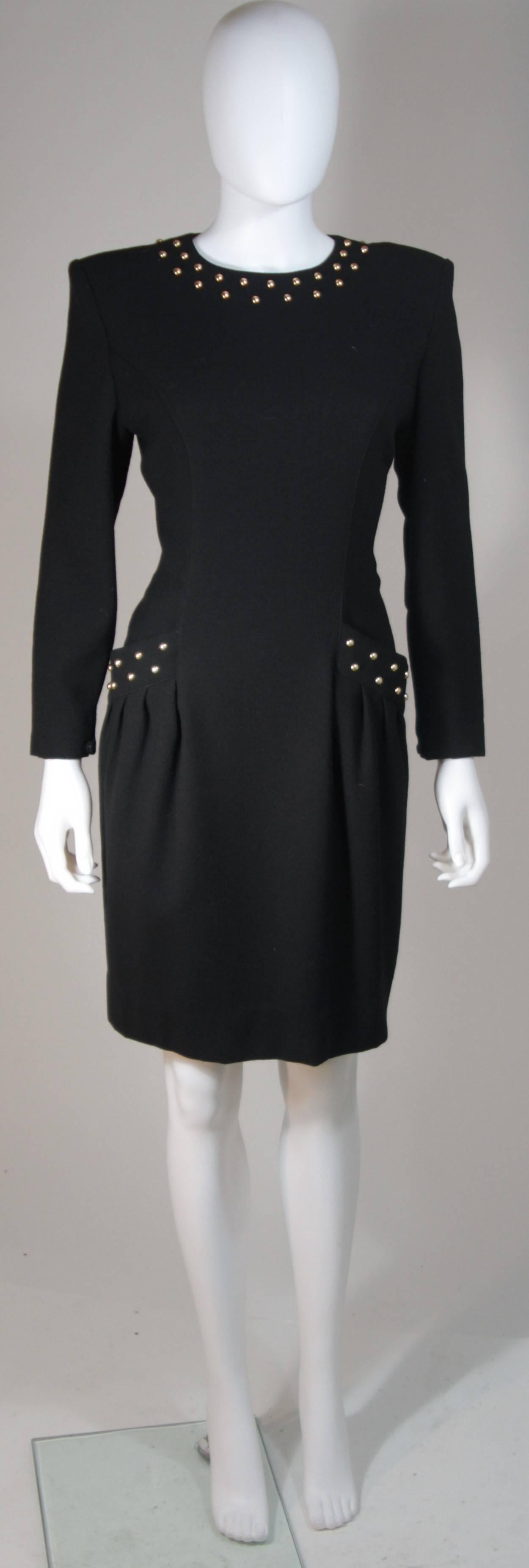  This Guy Laroche  cocktail dress is composed of a black fabric with gold stud applique. There is a center back zipper and front pockets with gathered detail. In excellent vintage condition. 

  **Please cross-reference measurements for personal