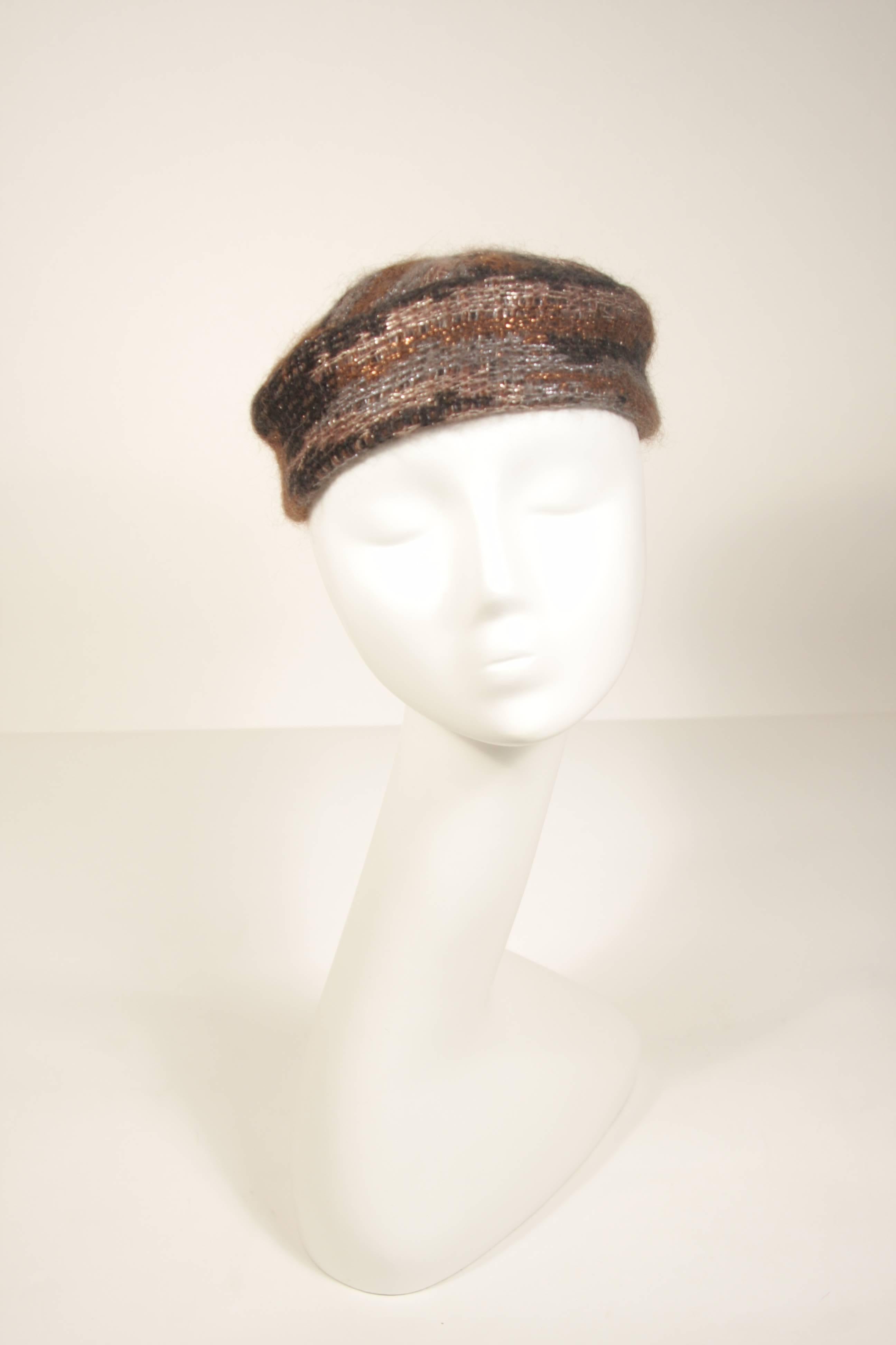 This Missoni design hat is composed of a Mohair blend in brown and grey hues with metallic accents. In excellent condition.

  **Please cross-reference measurements for personal accuracy. 

Measurements (Approximately)  
Circumference: 22