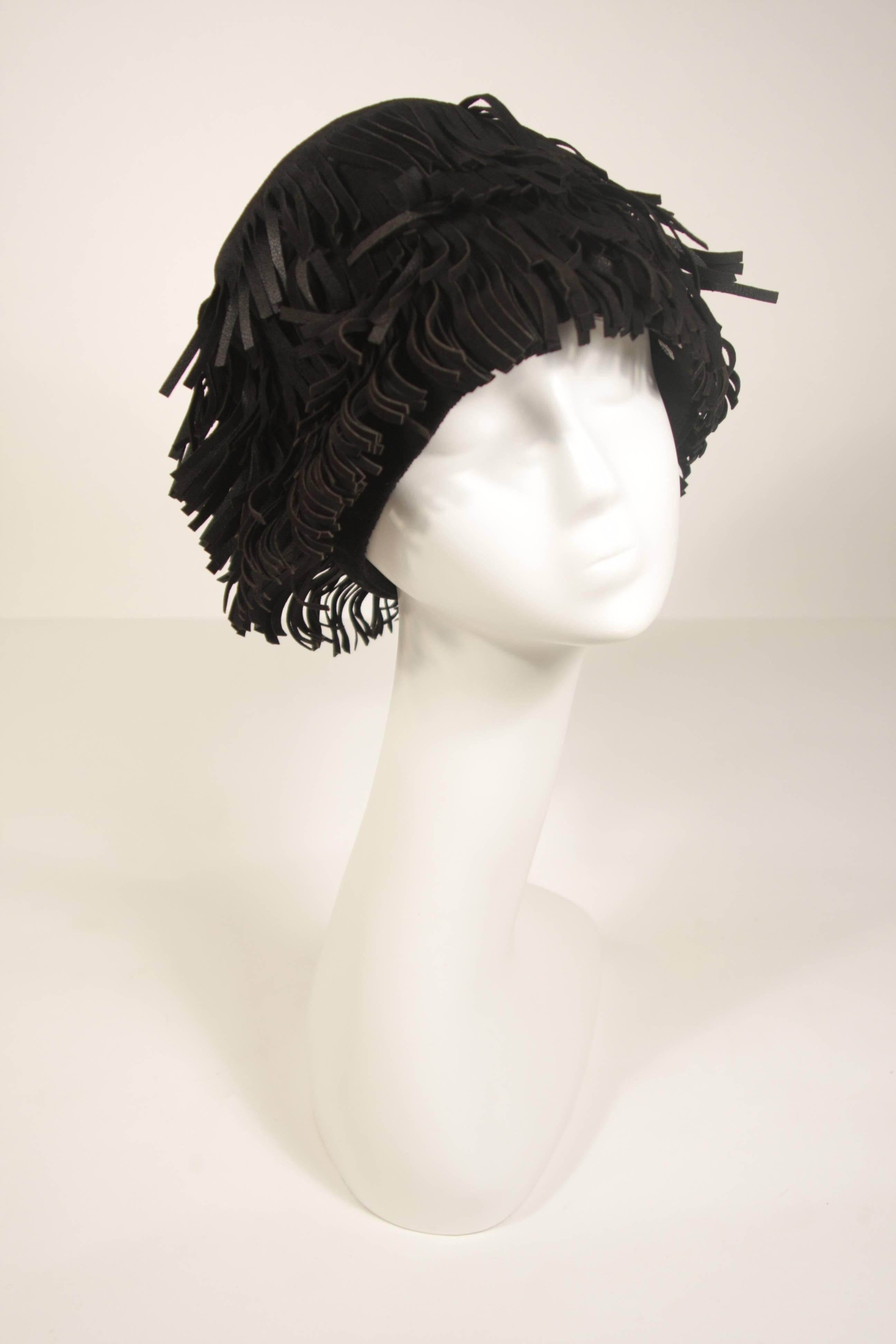This Yves Saint Laurent Rive Gauche design i hat is composed of a black suede with fringe. In excellent condition.

This YSL hat is from an extensive collection I acquired from the estate of a very wealthy lady who chose to live in Paris for several