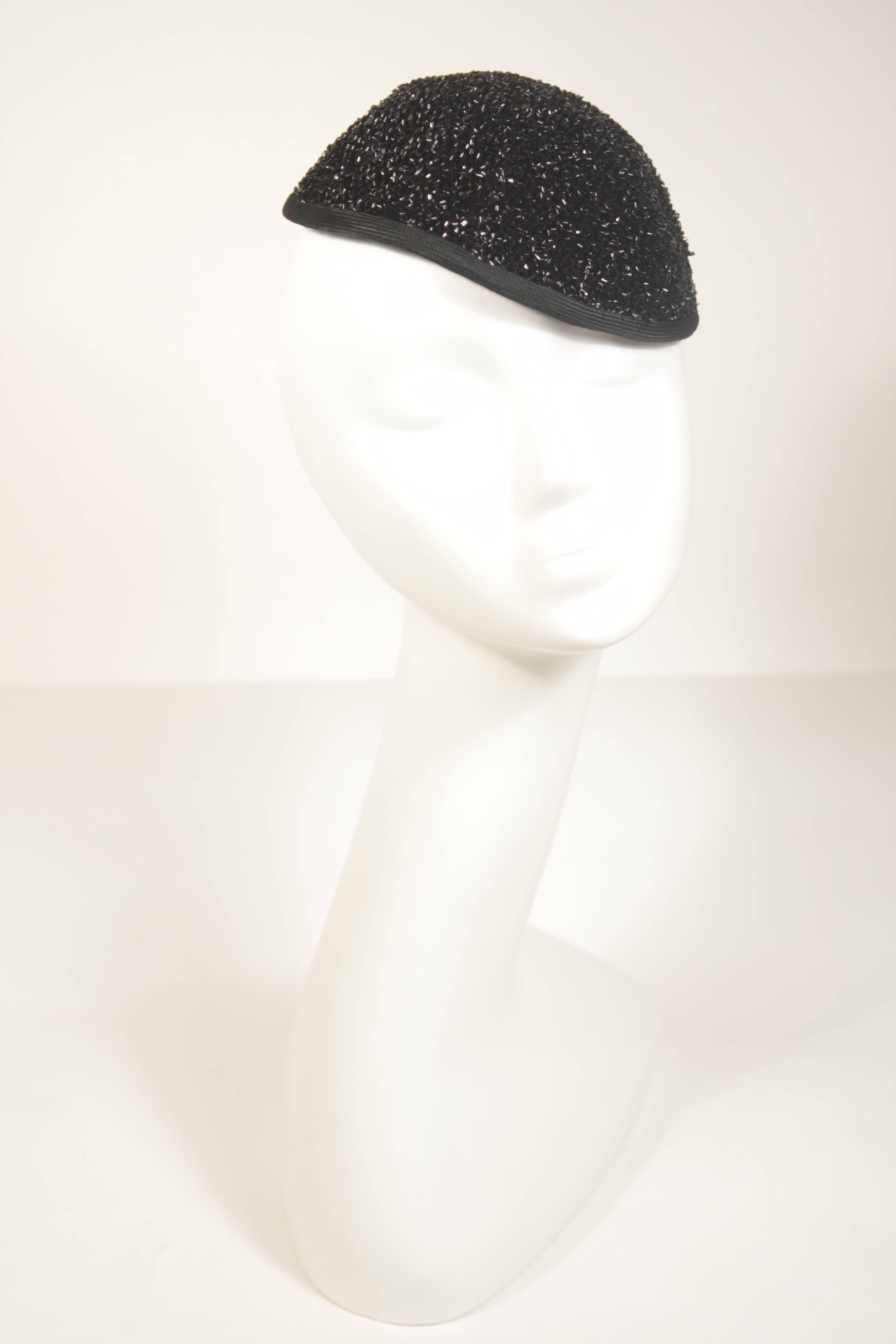 This YSL  hat is composed of a shiny reflective material with a skull cap style. In good vintage condition.

  **Please cross-reference measurements for personal accuracy. 

Measurements (Approximately)  
Circumference: 20 3/8