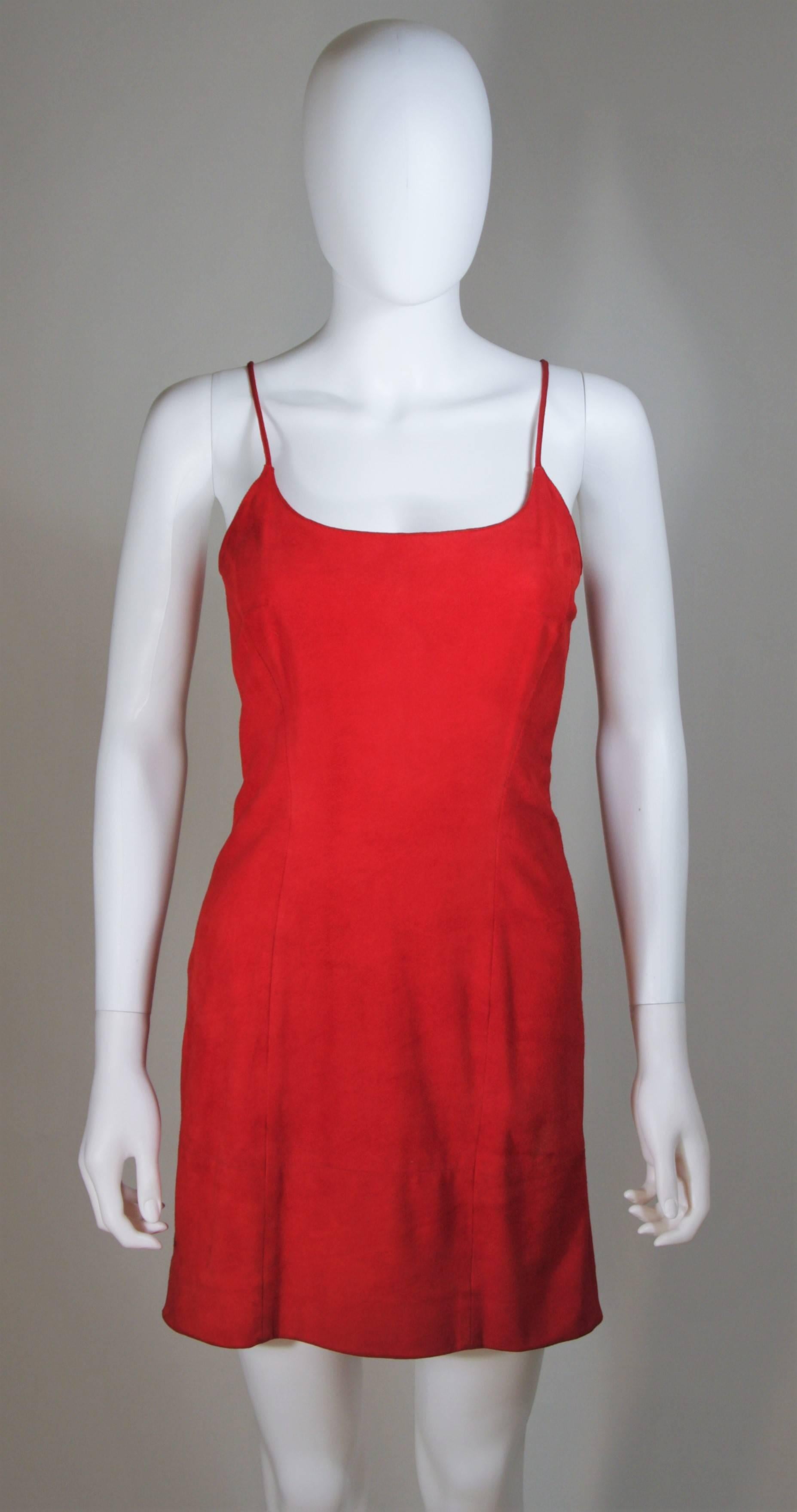   This Gucci design is available for viewing at our Beverly Hills Boutique. We offer a large selection of evening gowns and luxury garments. 

 This dress is composed of a red suede. Features an A-Line silhouette and center back zipper. In