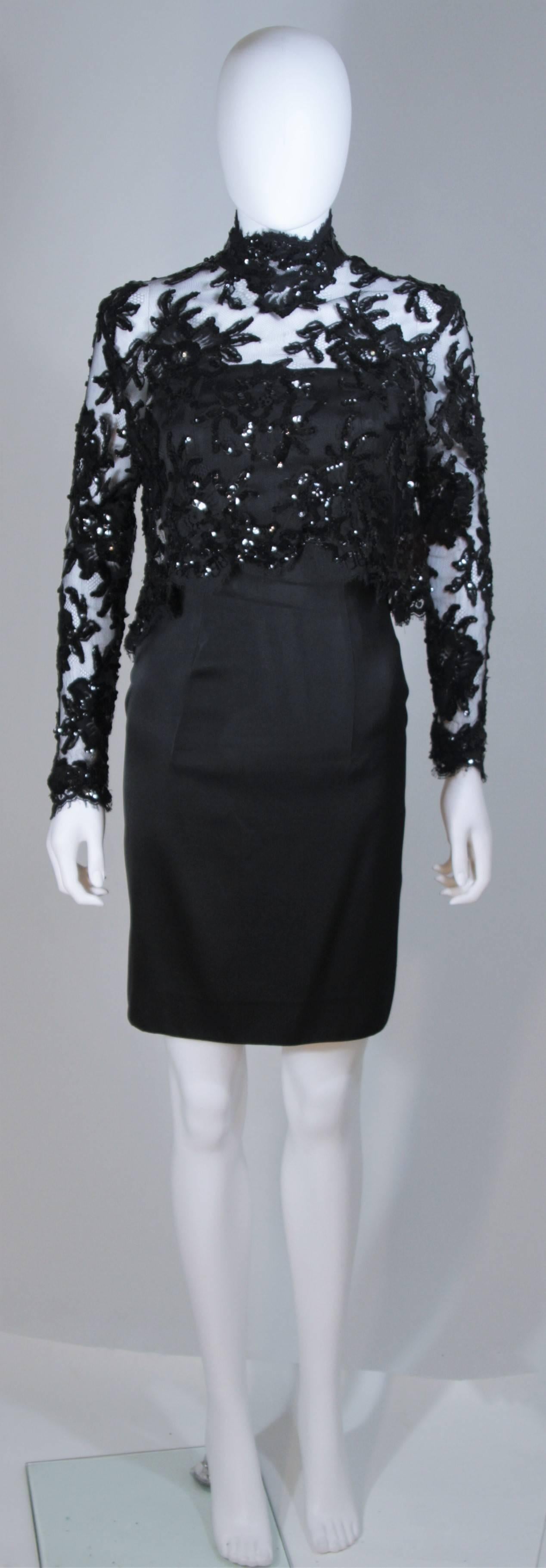   This Patrick Kelly  ensemble is composed of a black silk cocktail dress and a sequin lace blouse. The dress has a center back zipper closure and the blouse features snap closures with a mock style neck. In excellent vintage condition. 

 