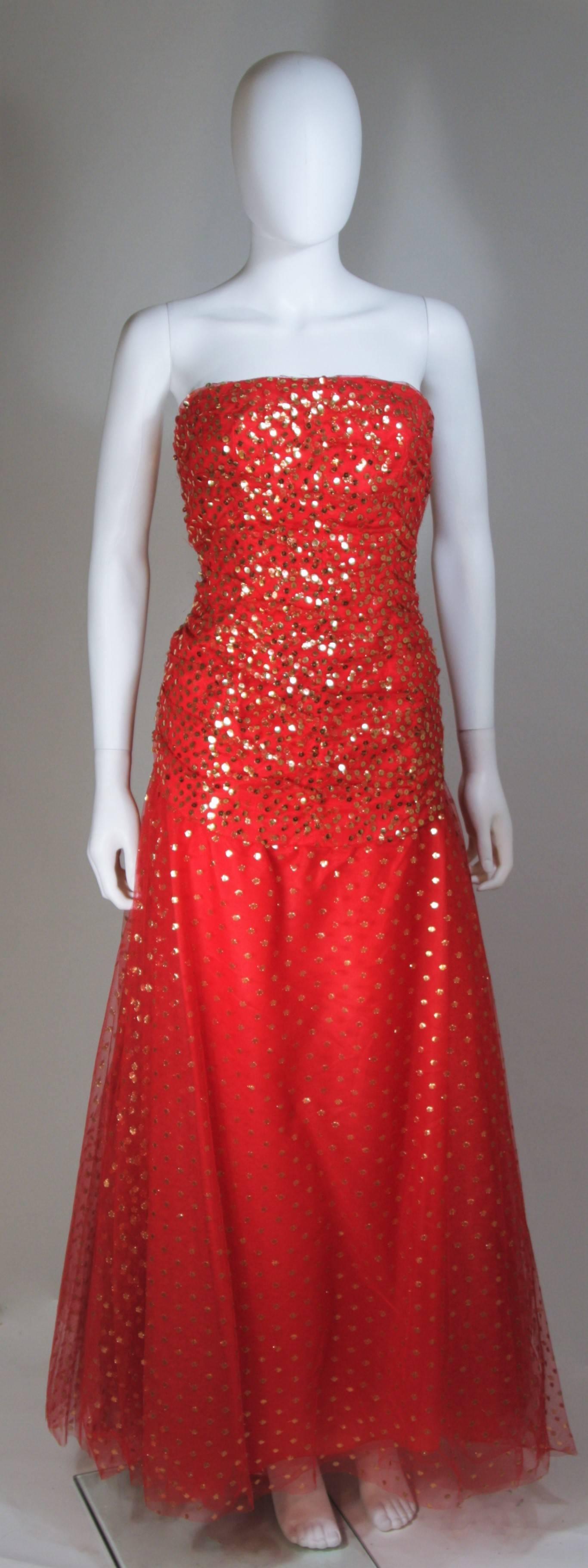  This Victor Costa  gown is composed of layered red mesh and is adorned with gold sequins. Features a ruched bodice with center back zipper closure. In excellent vintage condition. 

  **Please cross-reference measurements for personal accuracy.