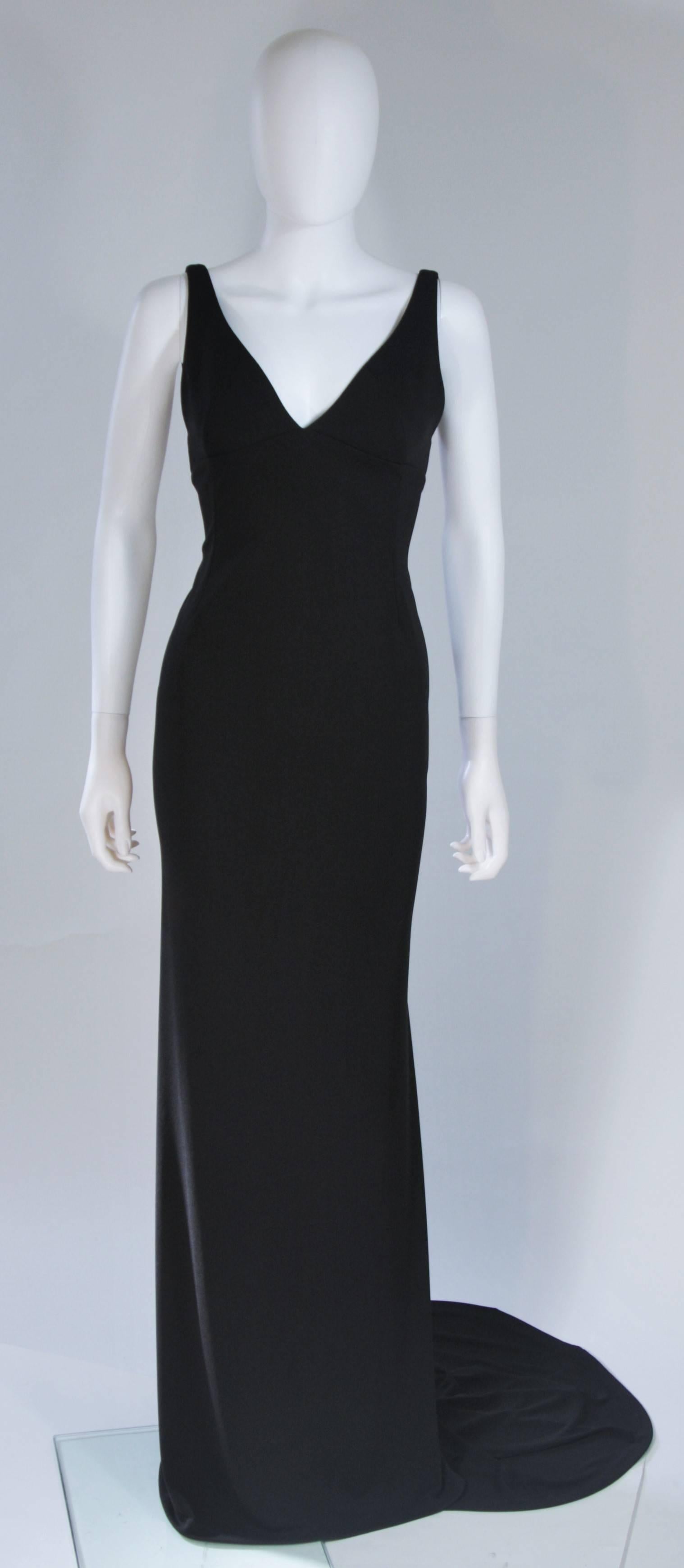  This Alex Perry  gown is composed of a black stretch jersey. The dress has a classic strap design and figure hugging contouring. There is a center back closure. In excellent condition. 

  **Please cross-reference measurements for personal