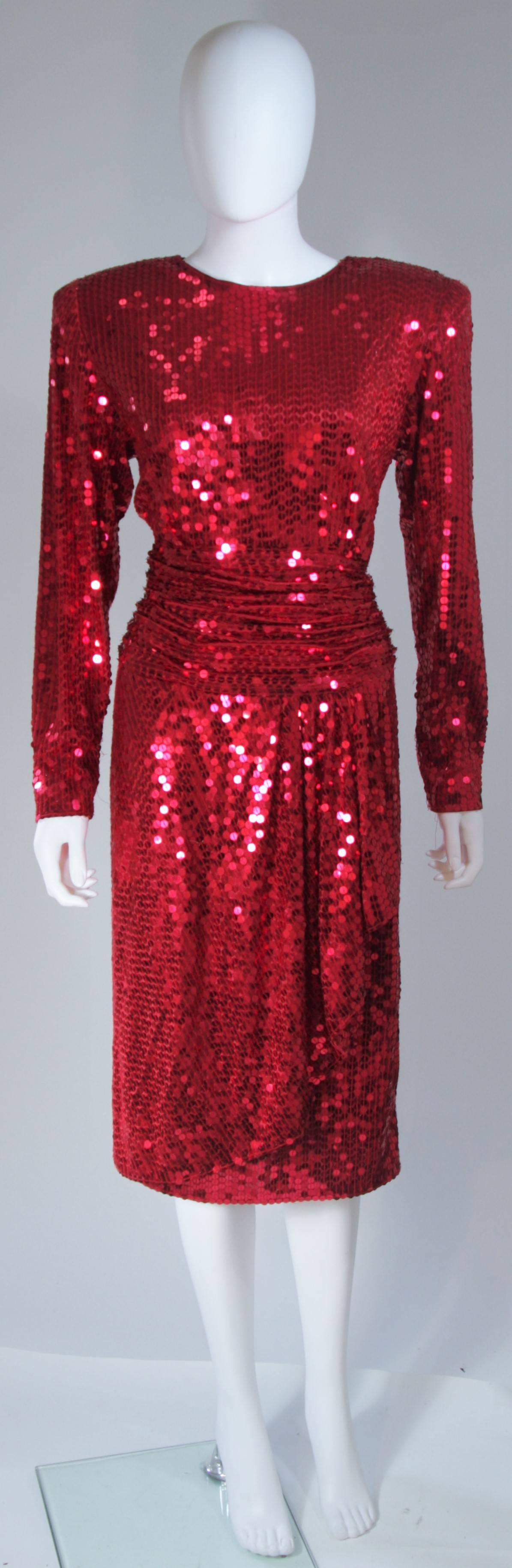  This Oleg Cassini cocktail dress is composed of a rich raspberry hue sequined fabric. There is a center front drape at the skirt and ruched waistline. Zipper closure. In great vintage condition. 

  **Please cross-reference measurements for