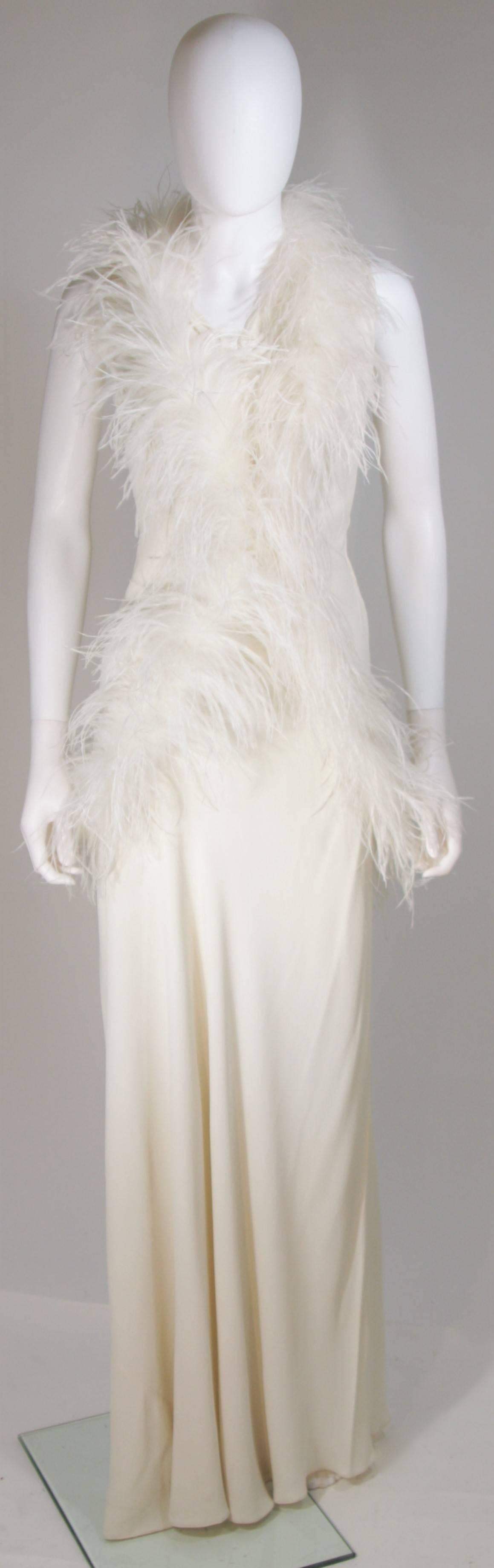 This Elizabeth Mason Couture wrap is available for viewing at our Beverly Hills Boutique. Fashioned from the finest feathers,  this wrap is created at Elizabeth Mason's Beverly Hills Atelier. We offer exclusive custom made couture gowns suited to