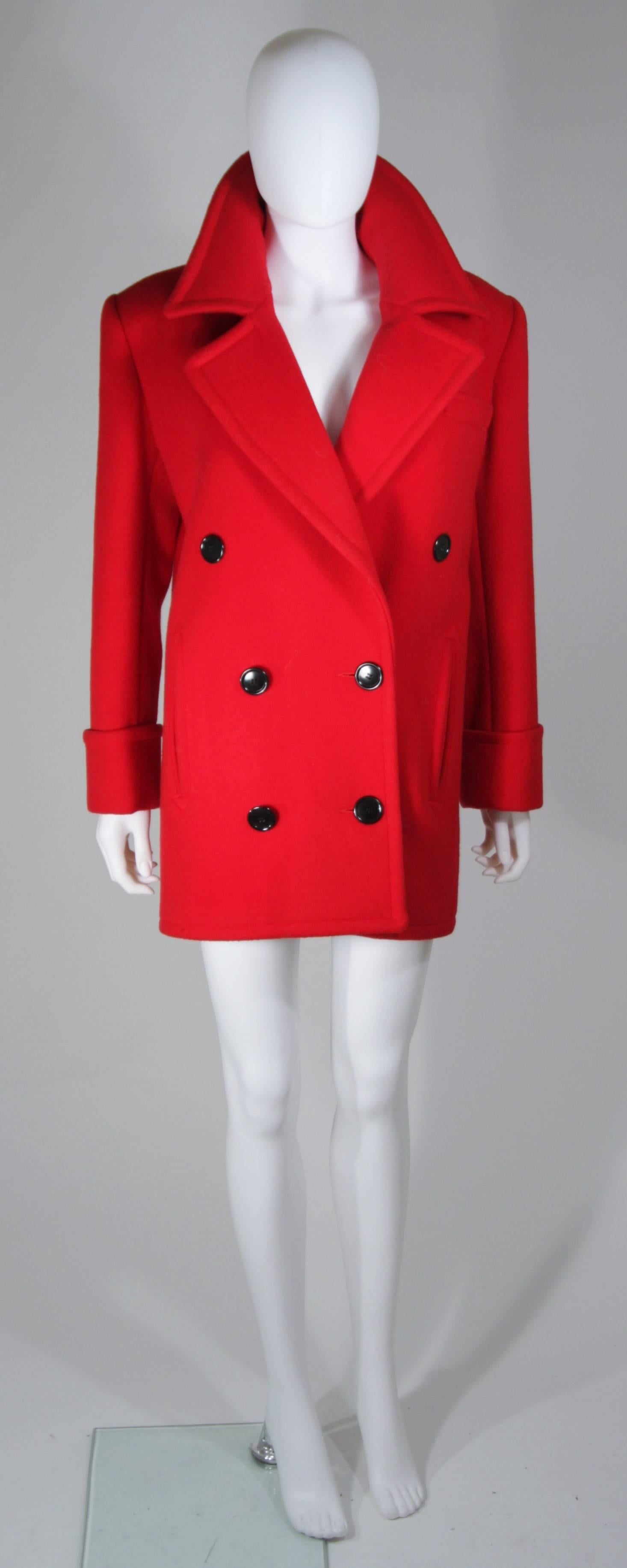   This Calvin Klein coat is composed of a vibrant red wool. There are side pockets and front button closures. In excellent vintage condition. 

  **Please cross-reference measurements for personal accuracy. Size in description box is an estimation.