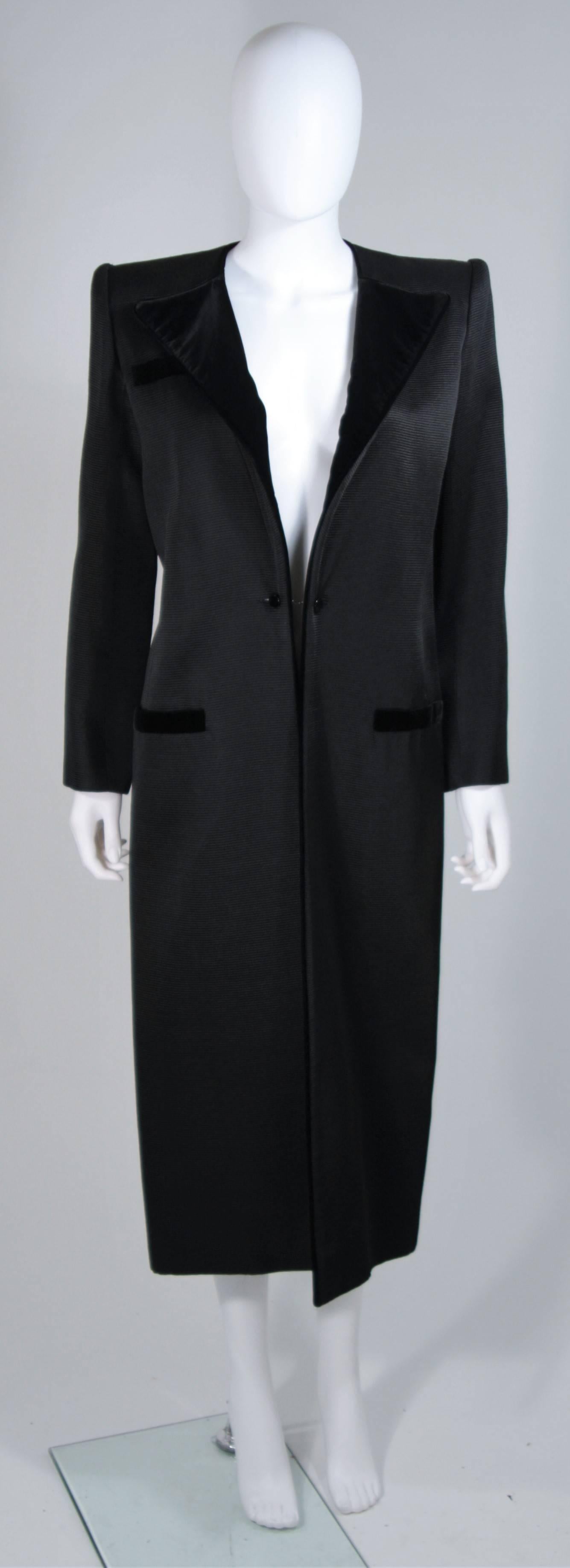   This Valentino  evening coat is composed of a black ribbed silk with velvet trim. Features a center front button closure and front pockets. In excellent vintage condition. 

  **Please cross-reference measurements for personal accuracy.