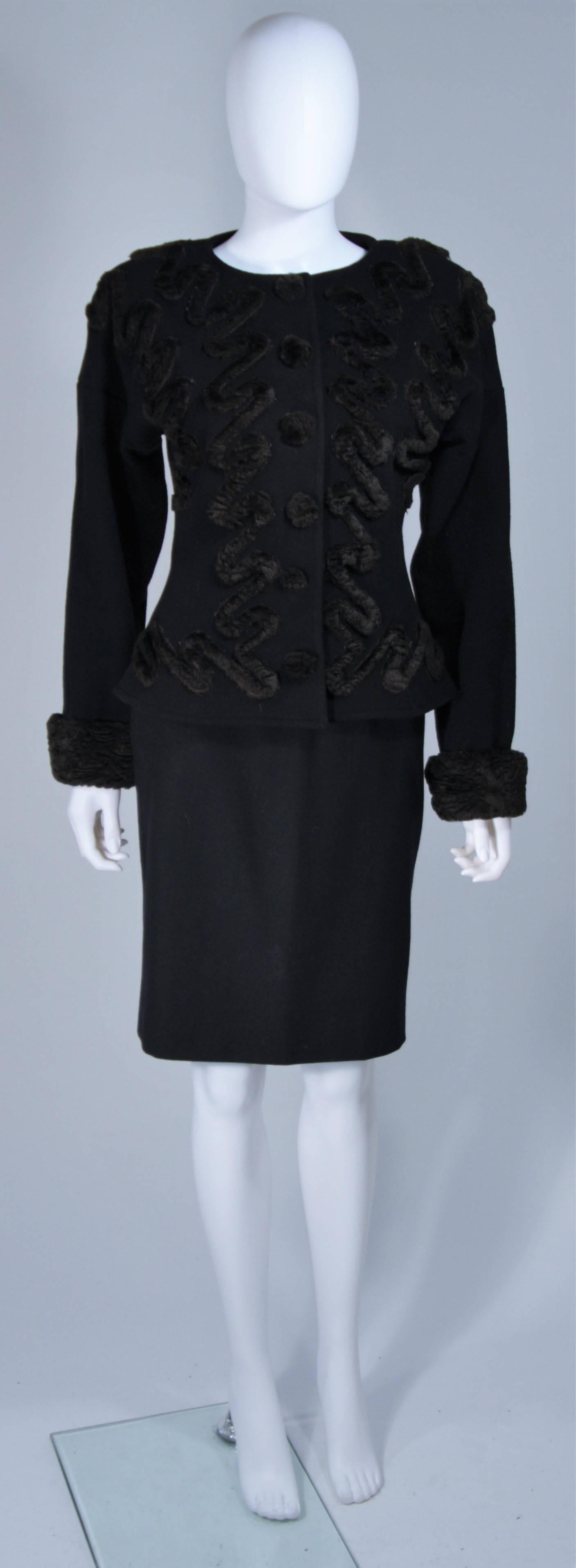  This Fendi skirt suit is composed of a black lana wool and features a brown faux fur applique in a swirl pattern. The jacket features center front button closures and the classic pencil style skirt has a zipper closure. In excellent vintage