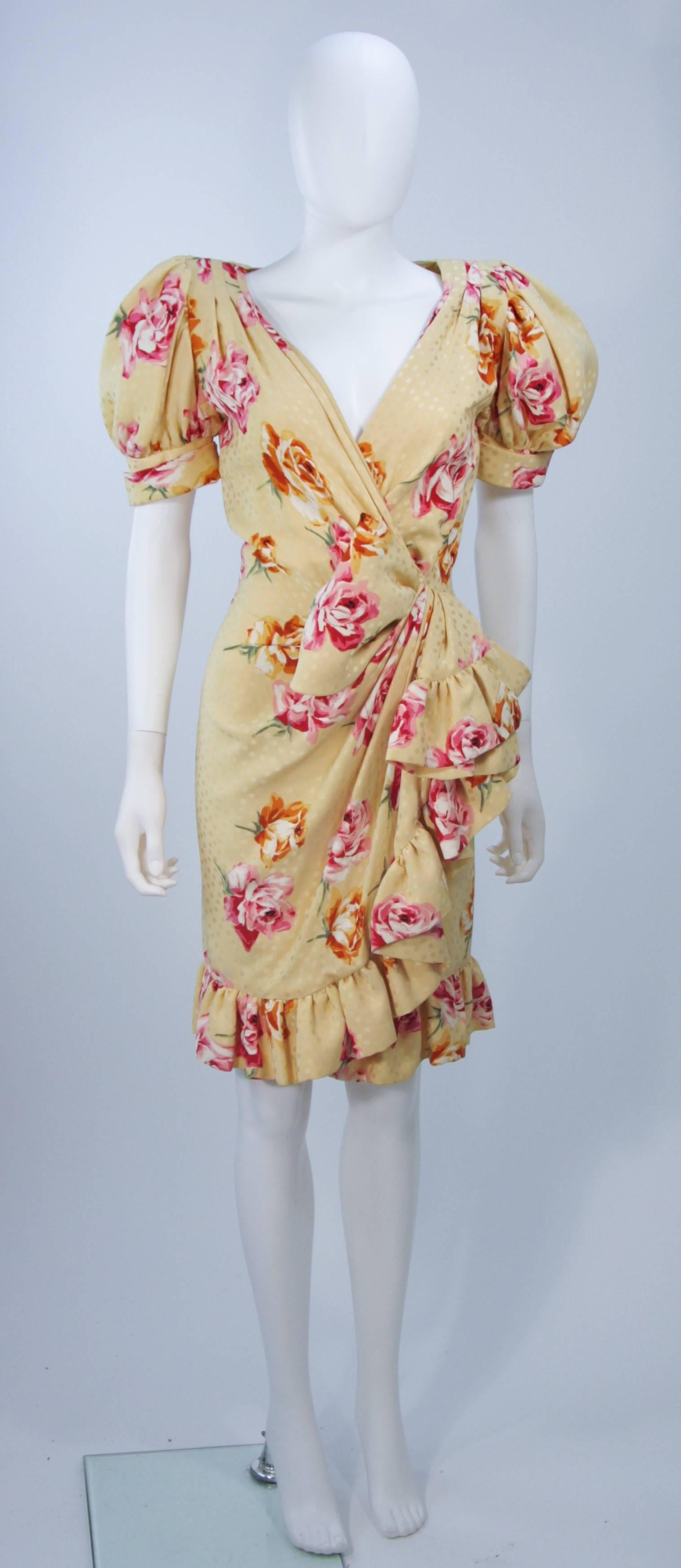  This Andrea Odicini dress is composed of a floral print yellow silk. The drape style design features a ruffled hem, puff sleeves, and a plunging neckline. There is a center back zipper closure. In excellent vintage condition. 

**Please