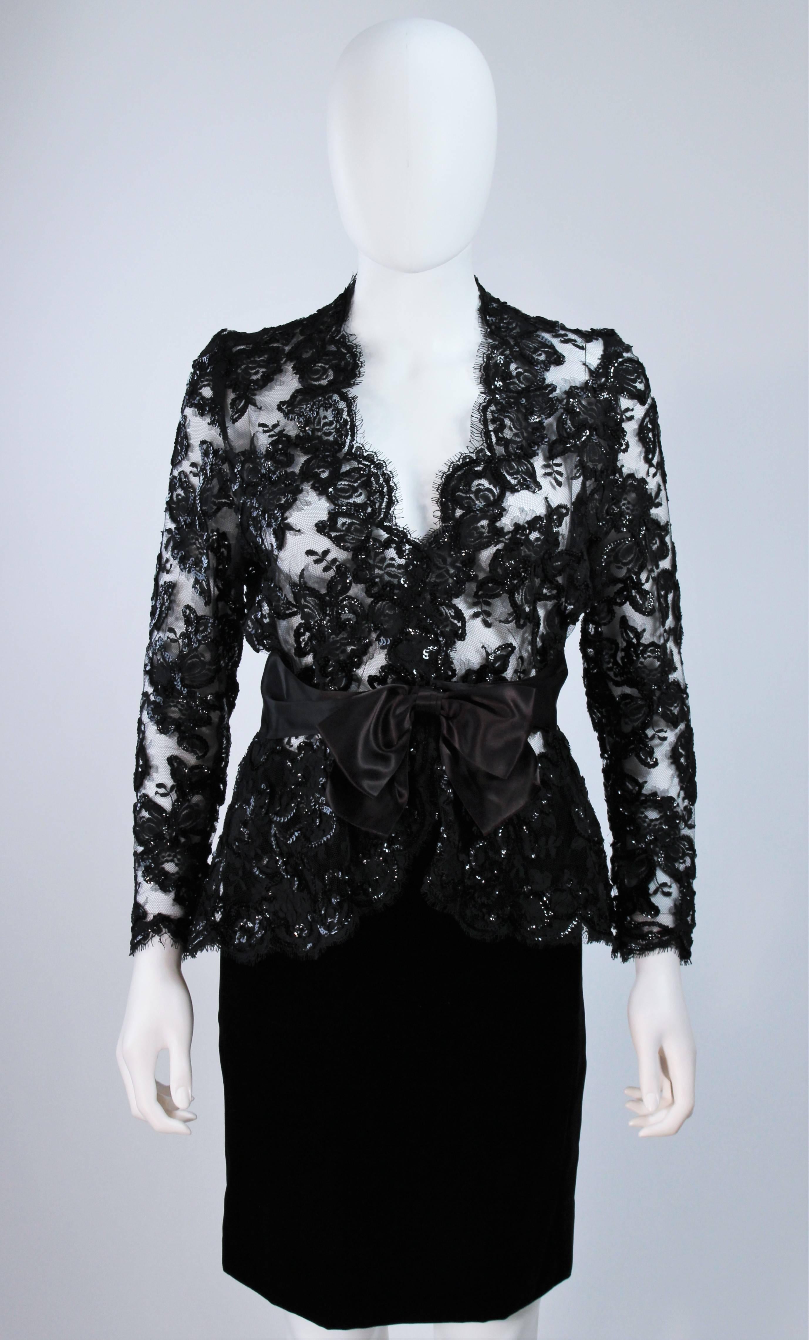  This Travilla skirt suit is composed of a black sequin embellished lace blouse with a silk bow and pencil style skirt. The blouse has center front hook and eye closures. The skirt has a zipper closure. In excellent vintage condition. 

**Please