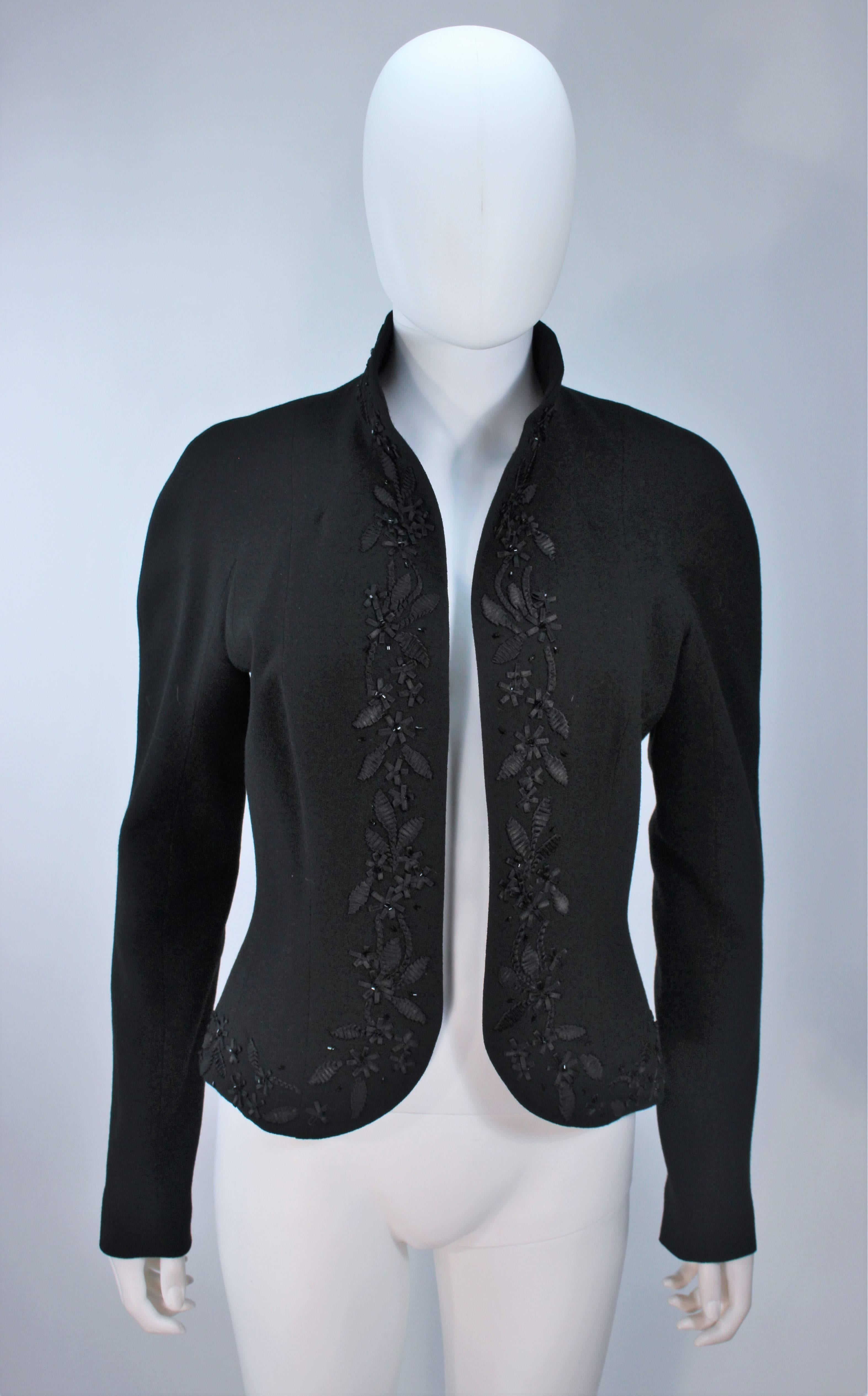  This John Galliano jacket is composed of a black silk and features an embellished trim. Open style. In excellent condition. 

  **Please cross-reference measurements for personal accuracy.  

Measures (Approximately)
Length: 22