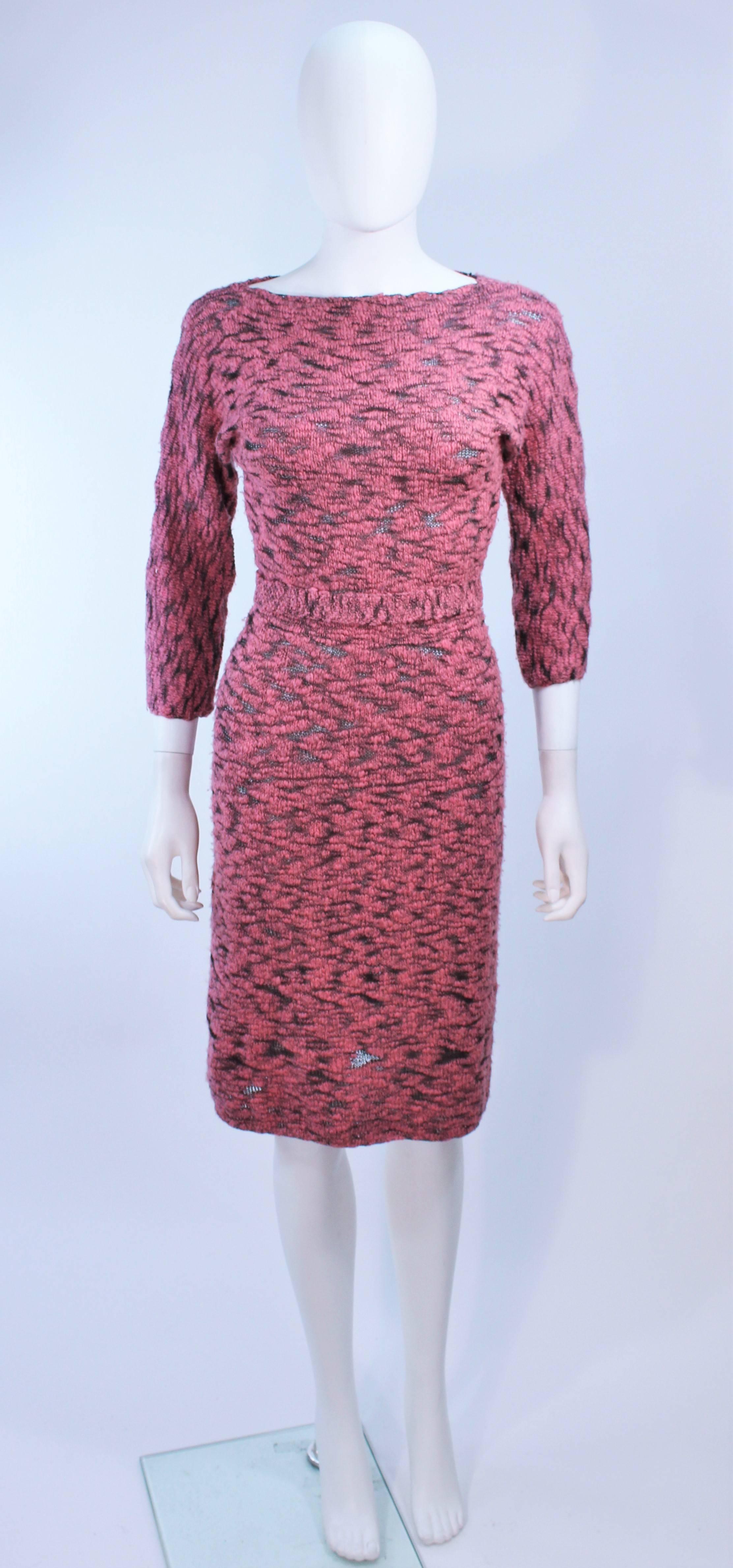 This Sydney's dress is composed of a stretch pink and black wool. Features a semi sheer design with belt. In excellent vintage condition.

**Please cross-reference measurements for personal accuracy. Size in description box is an