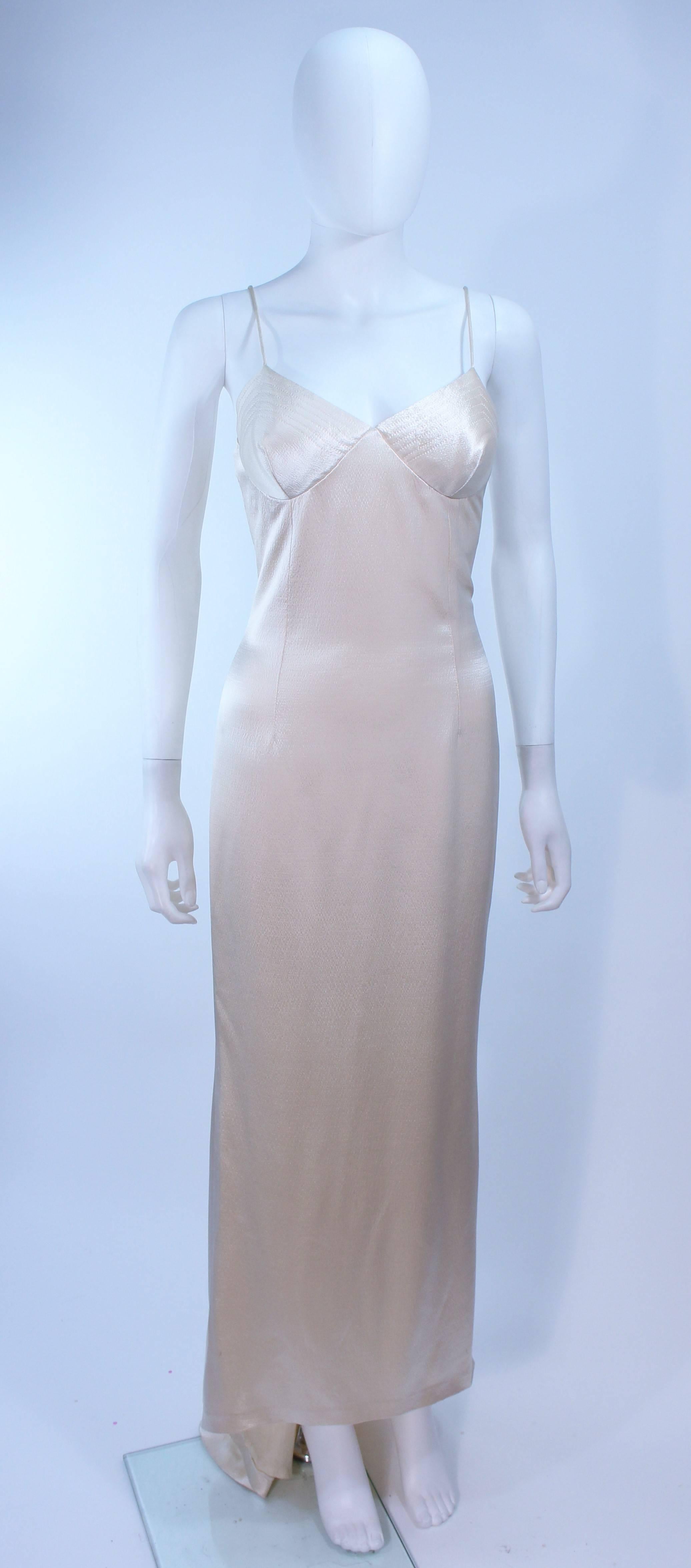 This gown is composed of an off white wool and silk blend with a top stitch bust detail. Features a train. There is a center back zipper closure with a hook and eye. In excellent vintage condition.

**Please cross-reference measurements for
