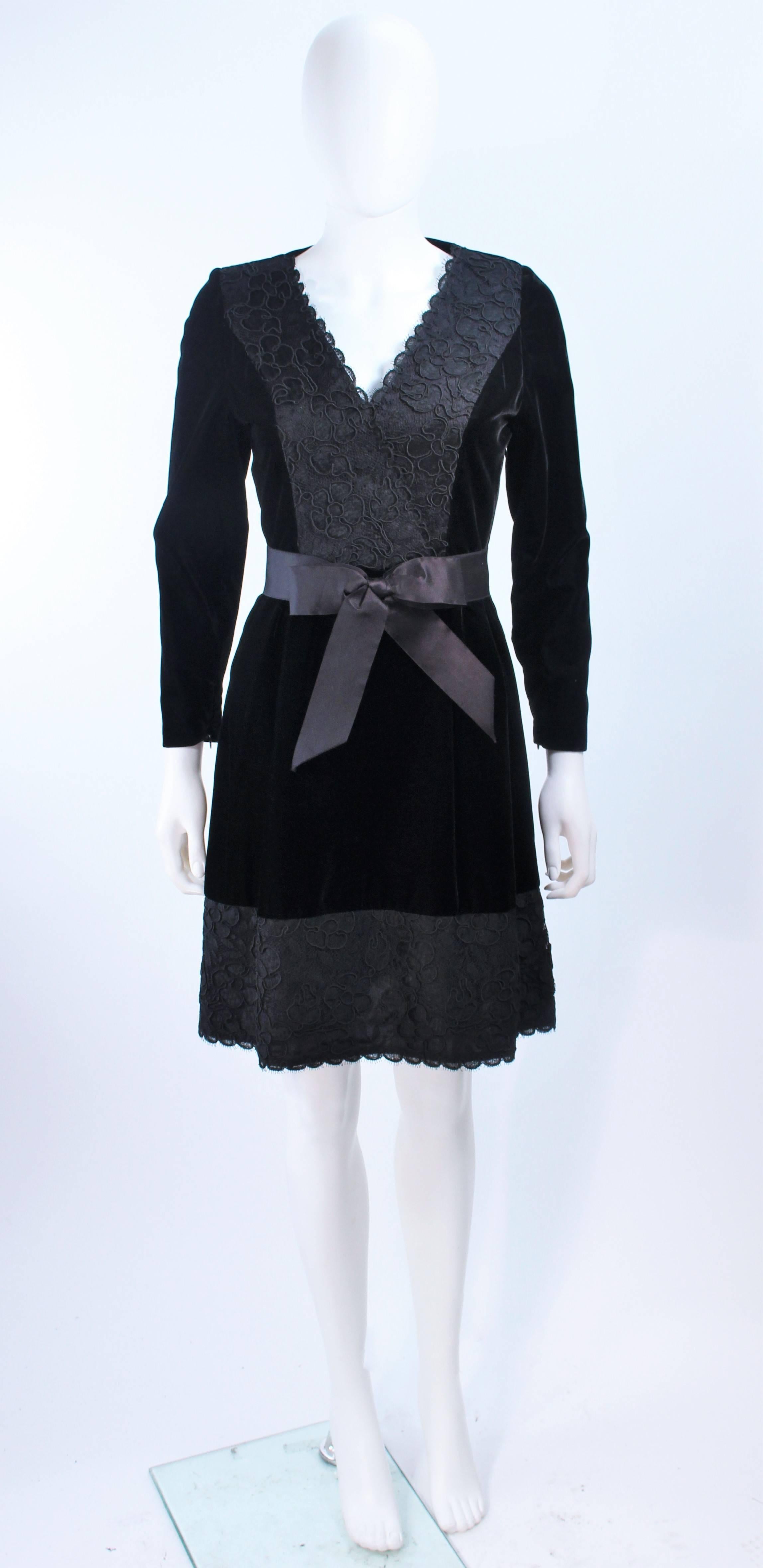 This Givenchy cocktail dress is composed of a beautiful velvet with lace trim. Features a satin belt and center back zipper closure. In excellent vintage condition.

**Please cross-reference measurements for personal accuracy. Size in description