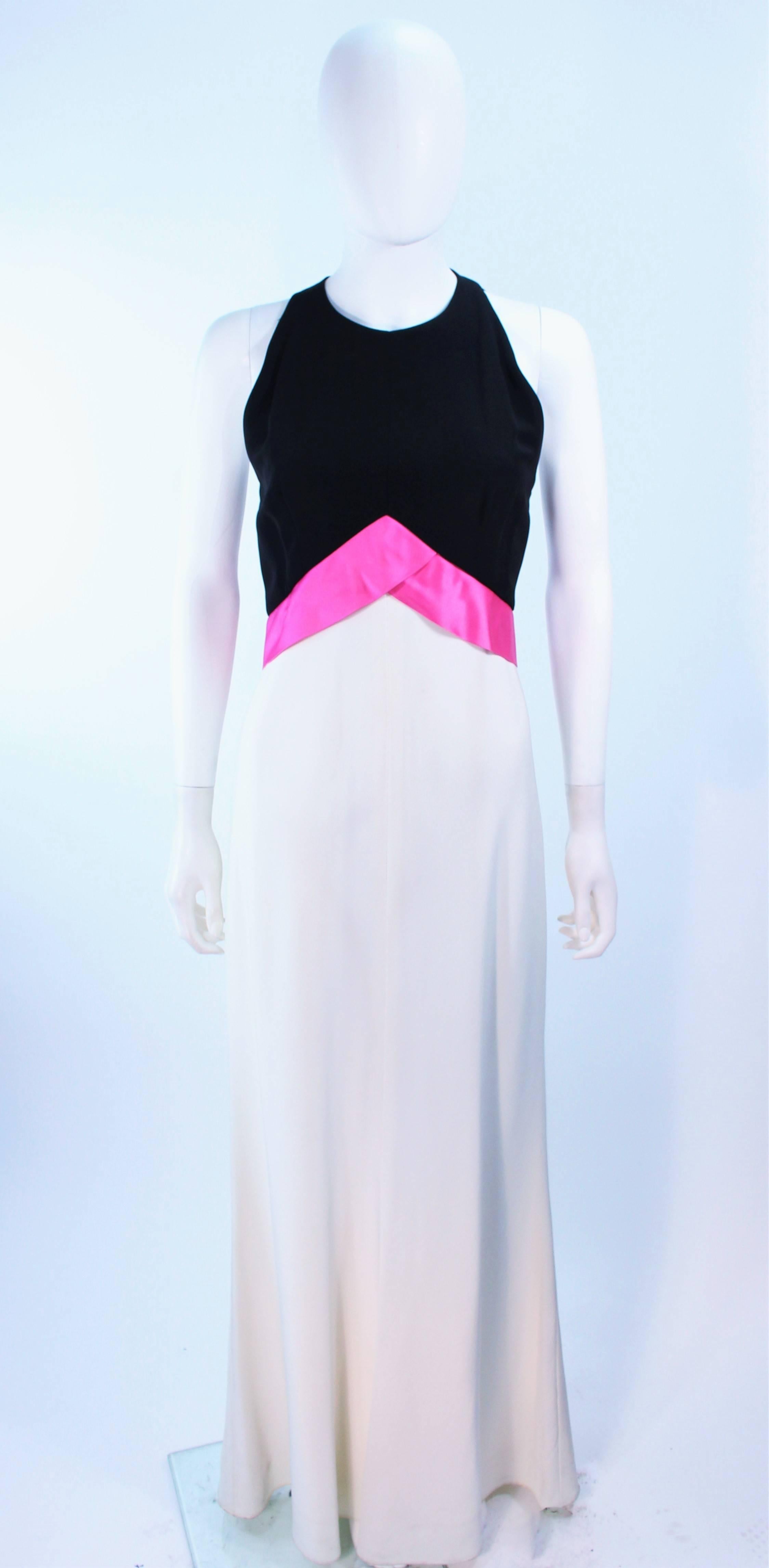 This Elizabeth Arden gown is composed of a black, pink, and cream combination with a satin contrast bow. Features a bias cut skirt. There is a center back zipper closure. In excellent vintage condition.

**Please cross-reference measurements for