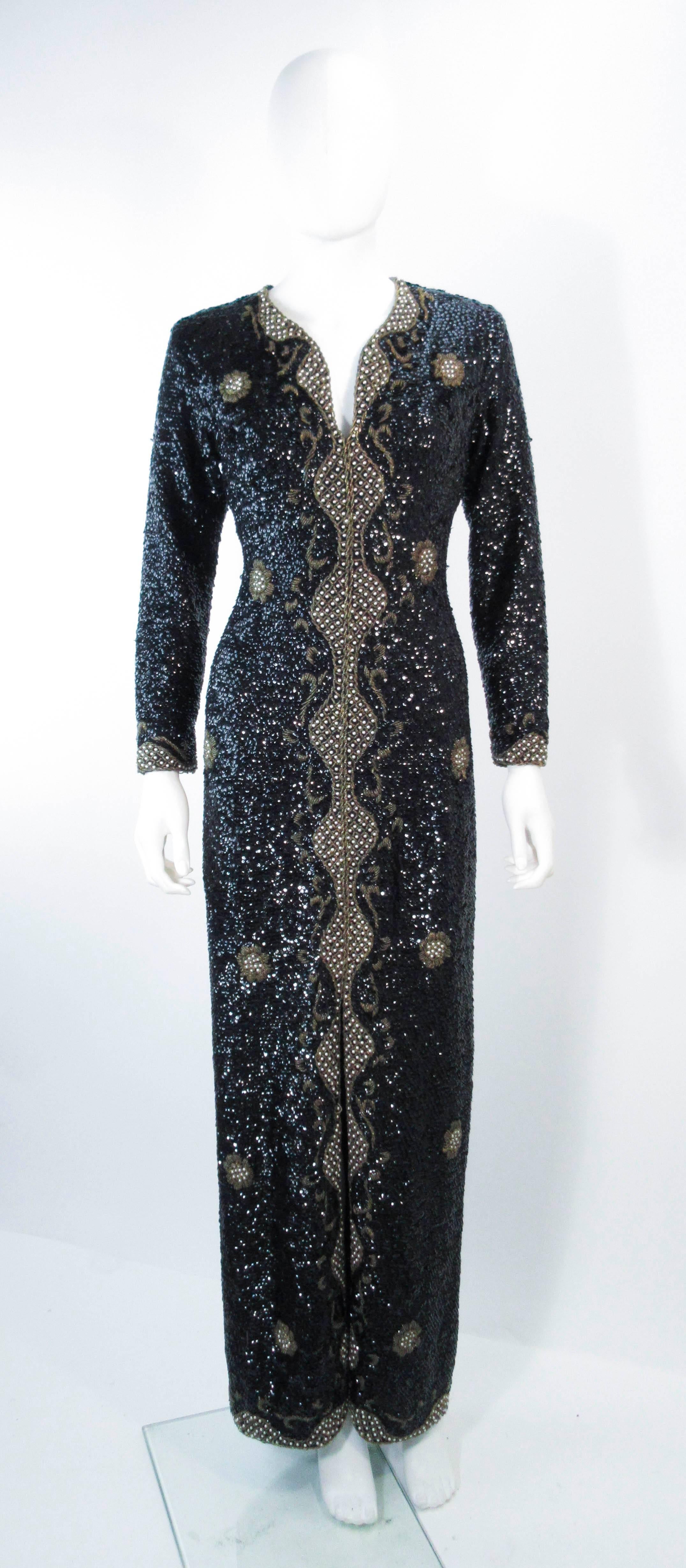 This vintage 1960's maxi gown is composed of a black & gold sequin knit with a gorgeous neckline and long sleeves. The rayon lining can be removed or made larger to suit the buyers need, since the top is a sequined knit. There is a center back