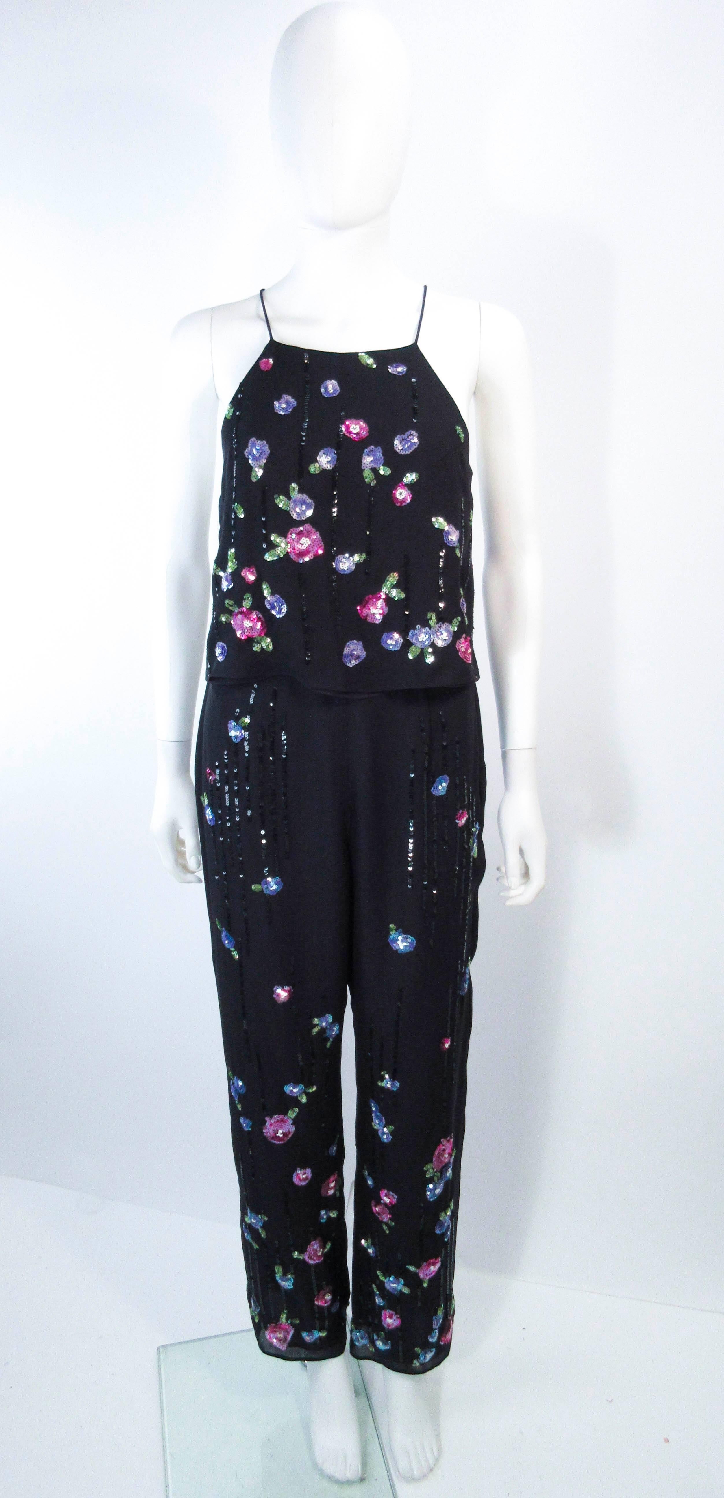 This Rimini set is composed of a black silk chiffon and features a sequin floral applique. The top is a tie style design and the pants have a nice slack style.  In great pre-owned condition (some signs of wear due to age).

**Please cross-reference