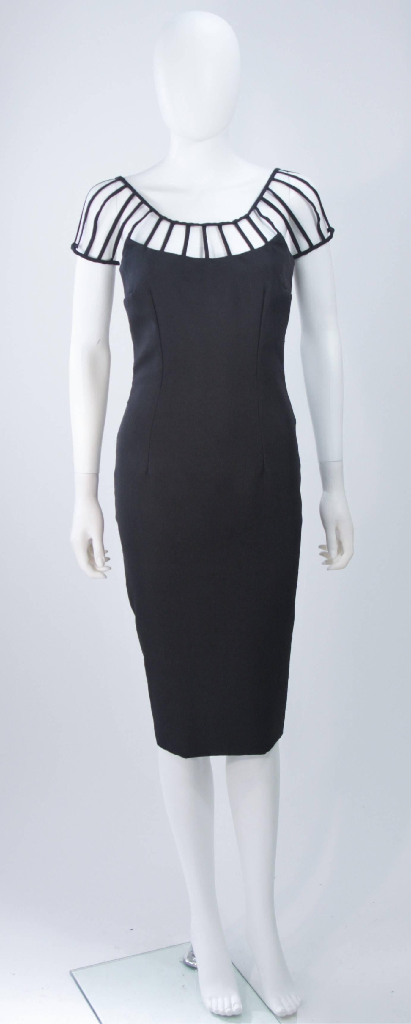 This ELIZABETH MASON COUTURE exquisite cocktail dress is fashioned from the finest black Silk Dupioni and features a gorgeous body skimming silhouette and an eye catching floating cage detail. 

This is a couture custom order and can made a variety