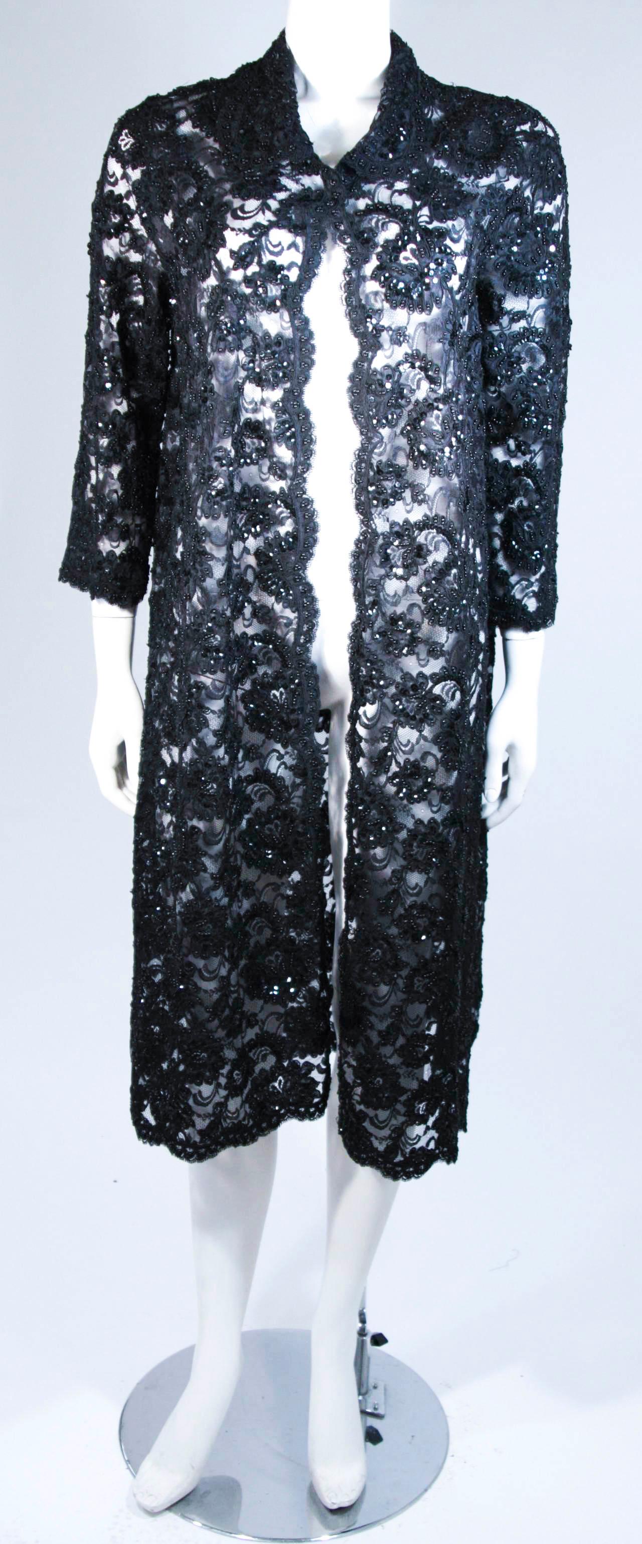 Fashioned from the finest black lace adorned with beading and sequins. This exquisite design can be combined with an ELIZABETH MASON COUTURE cocktail dress as photographed (sold separately). There are hook and eye closures. This is an exceptional