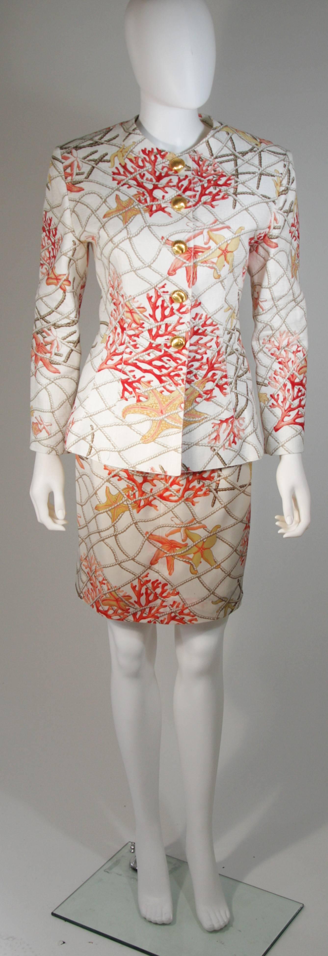 This Valentino design is available for viewing at our Beverly Hills Boutique. We offer a large selection of evening gowns and luxury garments. 

 This skirt suit is features a coral reef theme with rope pattern. The jacket features center front