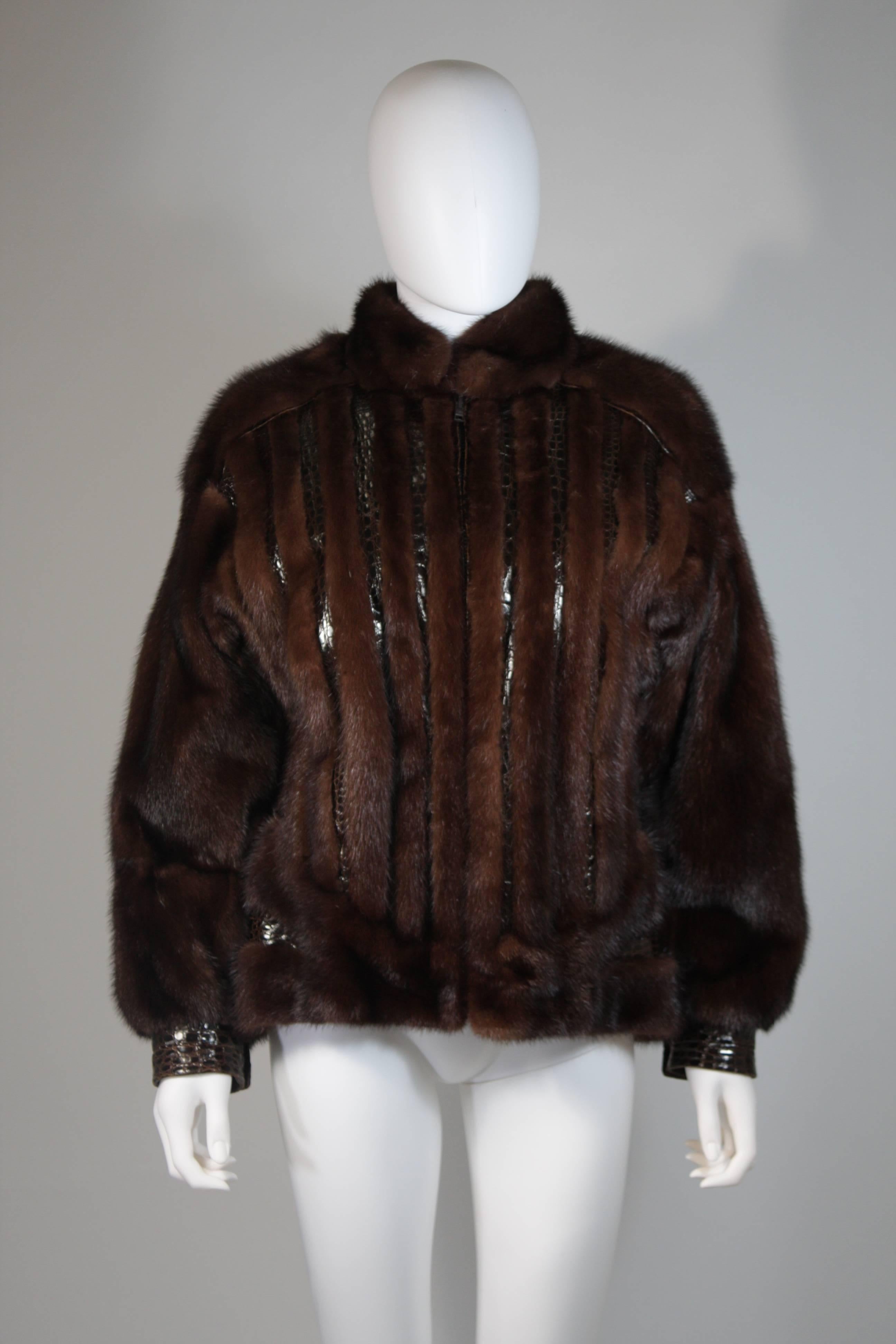 This Giorgio Sant'Angelo coat is composed of a rich brown mink and alligator combination with leather trimming/accents. This ultra supple coat features a center front zipper closure and side pockets. This coat is in excellent condition. Very easy to