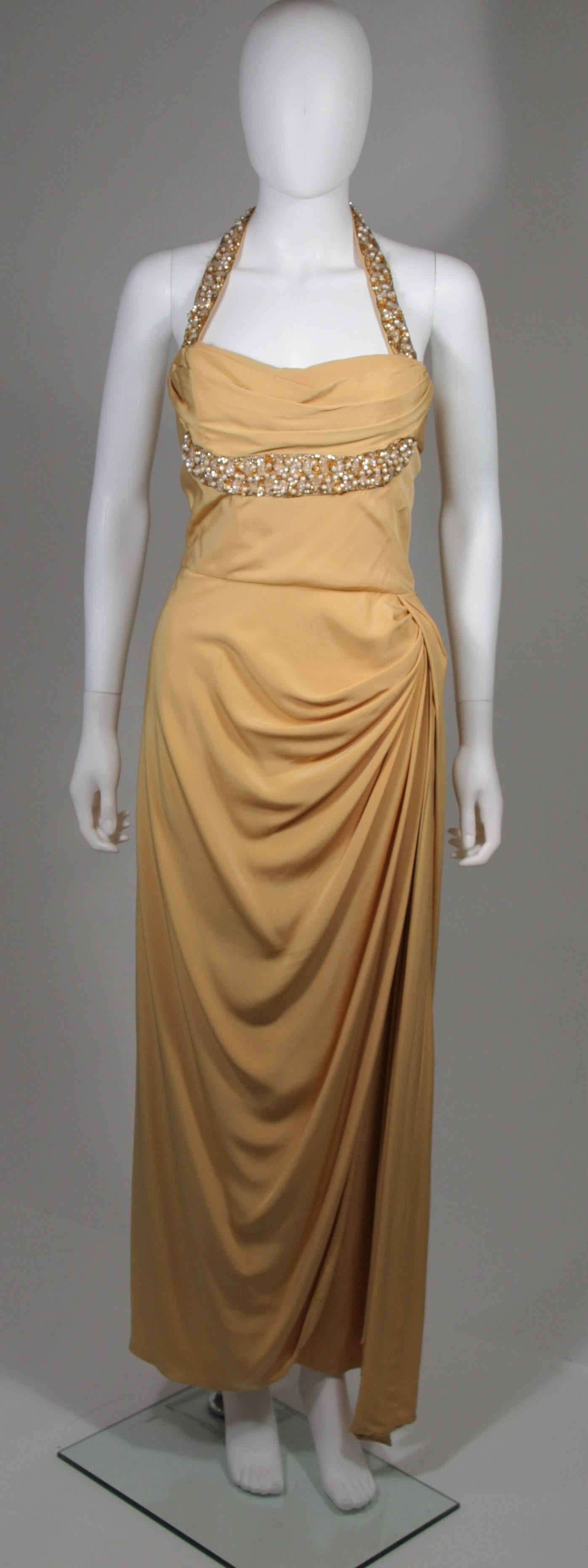 This Dorothy O'Hara attributed custom gown is composed of a gold silk and features sequin and faux pearl applique. There is a zipper closure with hook and eyes. A gorgeous draped design in excellent vintage condition. 

**Please cross-reference