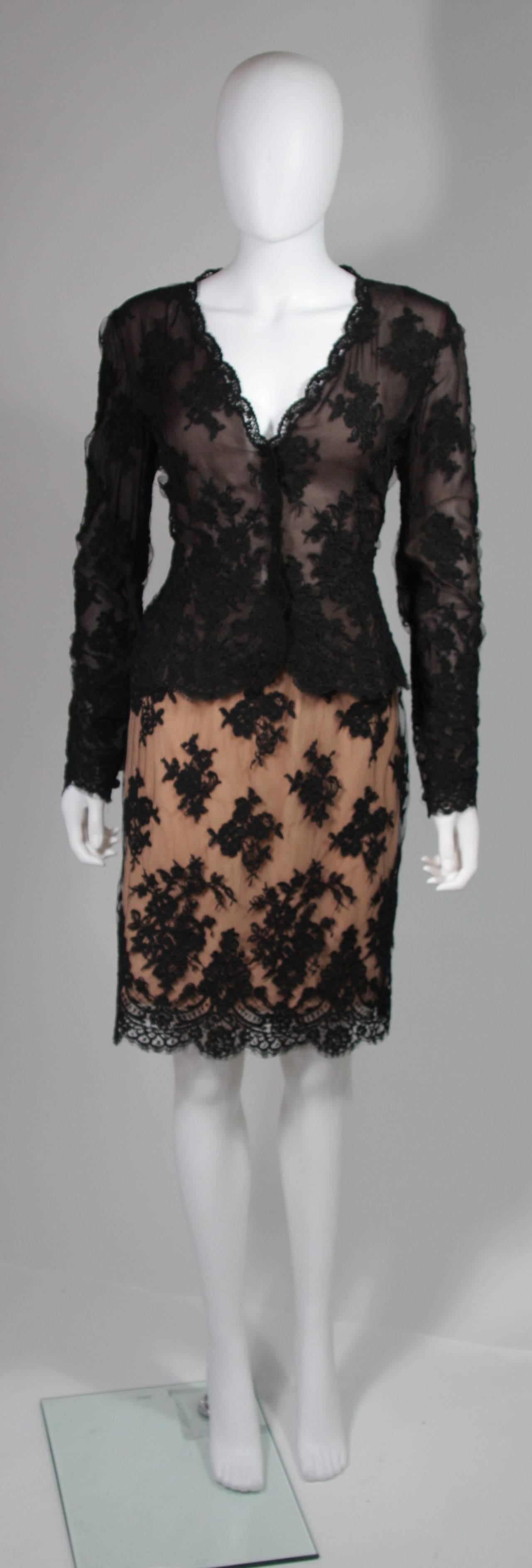 This Bill Blass skirt set is composed of a black lace with nude underlay accents on the skirt. The blouse features scalloped edges and center front snap closures. The skirt has a zipper closure. In excellent condition. Made in USA.

**Please
