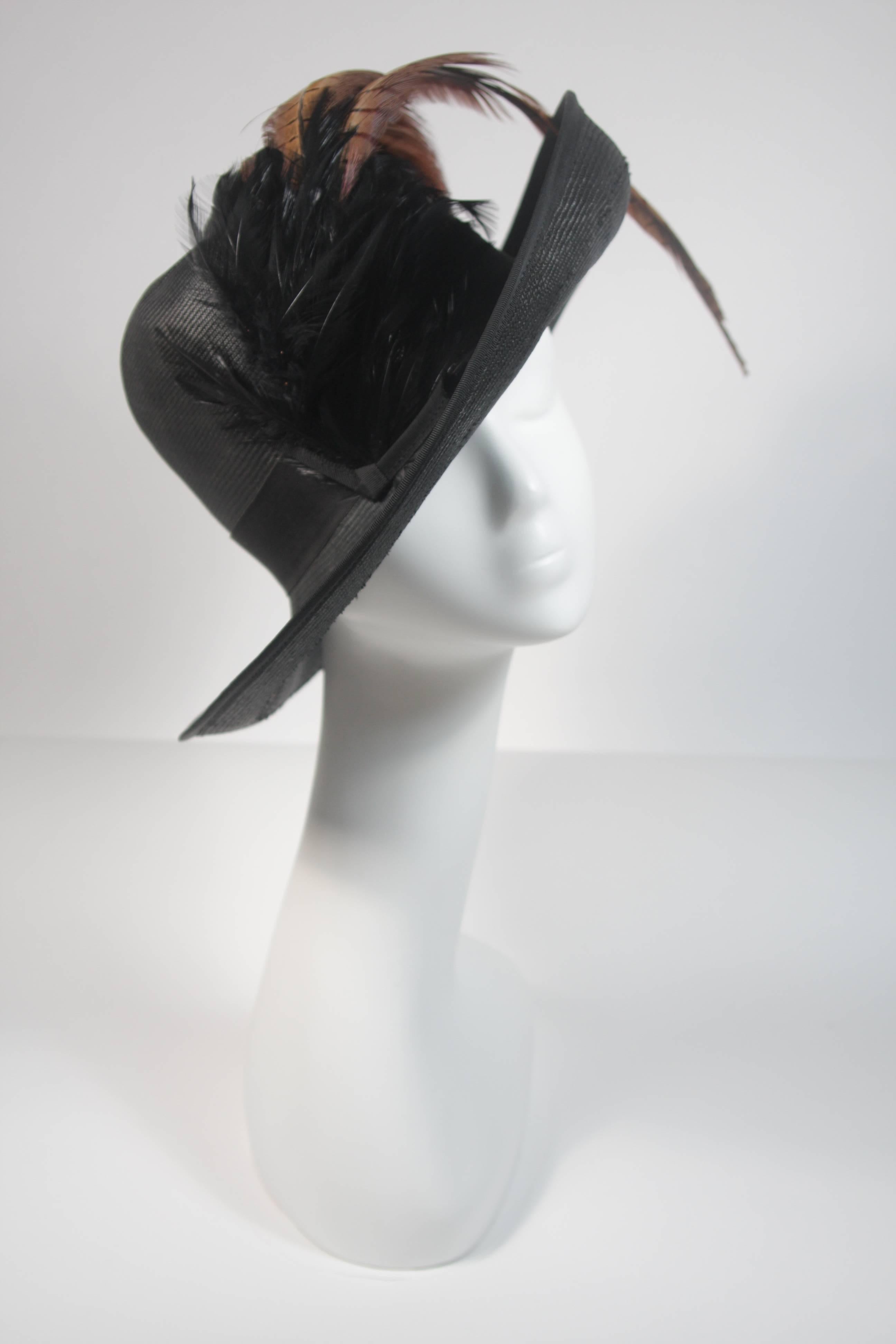 This Mr. Charles hat is composed of a black woven material and features an array of natural color feathers. In excellent vintage condition. 

**Please cross-reference measurements for personal accuracy. 

Measurements (Approximately)  
Height: