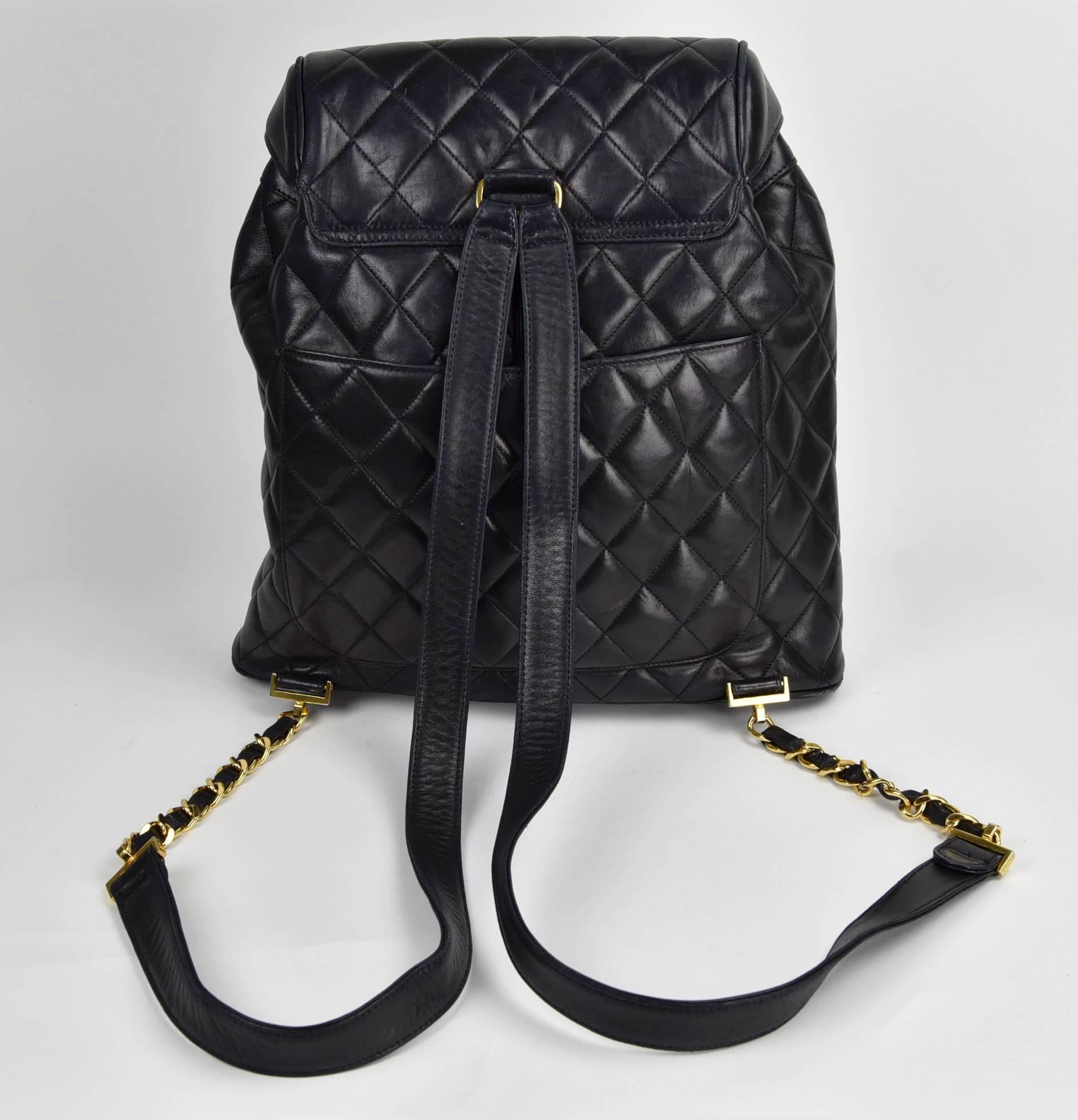 A fabulous Chanel backpack in beautiful condition.  Quilted black lambskin leather with gold large CC turncock closure in front. Signature woven chain and leather shoulder straps.  This is a classic Chanel piece with the high quality 1990s leather