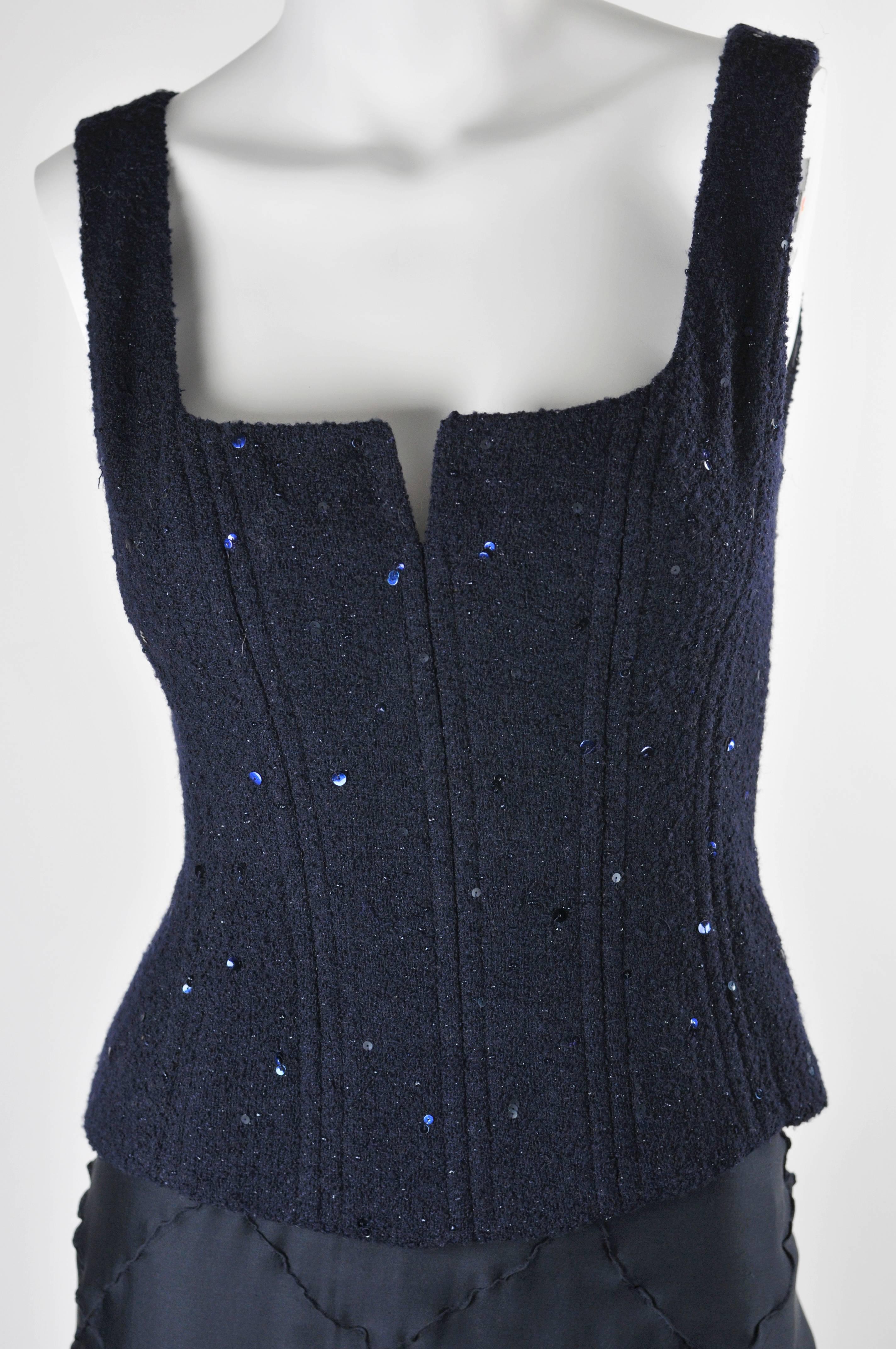 Classic Chanel Boutique Bustier with 9 double (18) vertical bones with additional inner structure of two horizontal ribbons. Fabric 90% wool and 10 % nylon and overall navy sequins with 100% silk lining. FR 36. The best ever Chanel bustier. Paired