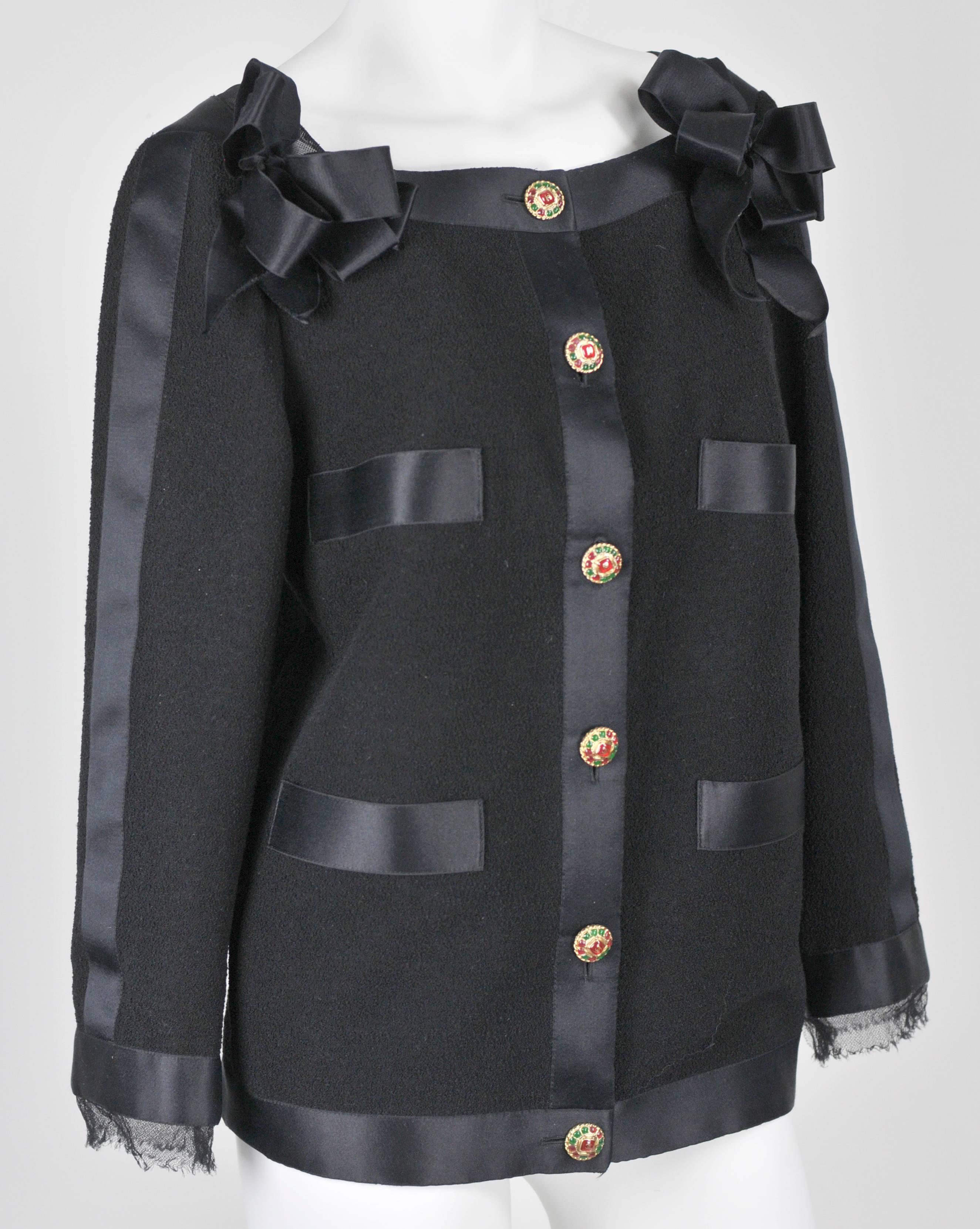 This gorgeous Jacket is the essence of Chanel glamour:  black boucle fabric, completely outlined in heavy 1 1/2