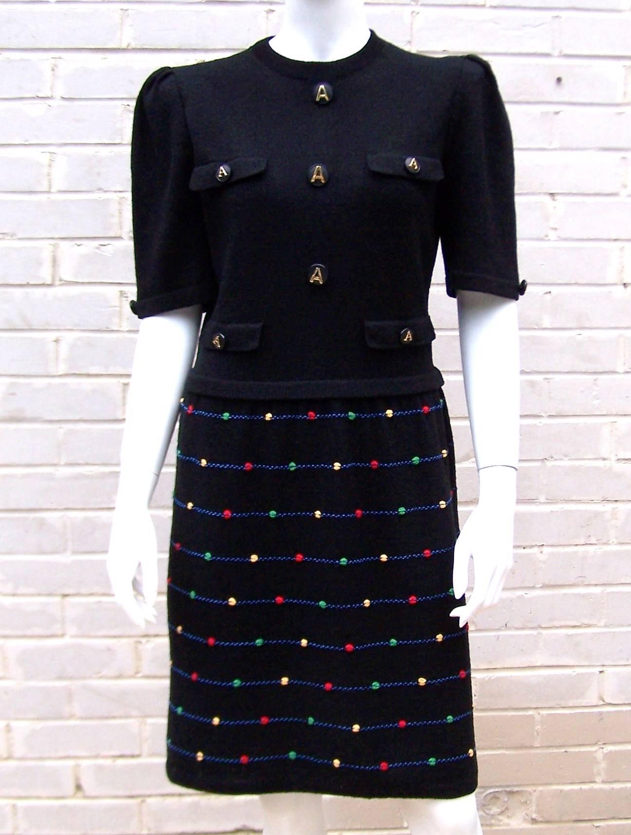 Ladylike and refined are characteristics of Adolfo clothing from 1970s-1980s.  This black cardigan dress suit fits that description with the added whimsical bonus of a colorful dot design and large logo buttons.  There is a Chanel inspiration to the