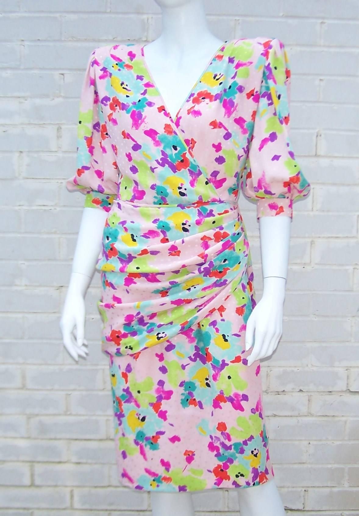 This 1980s Ungaro silk dress has a beautiful body hugging style.  The gorgeous jacquard floral fabric is draped and ruched at the hips with a hidden zipper at the side.  Shoulder pads add drama to the hourglass silhouette.  It is fully lined with a