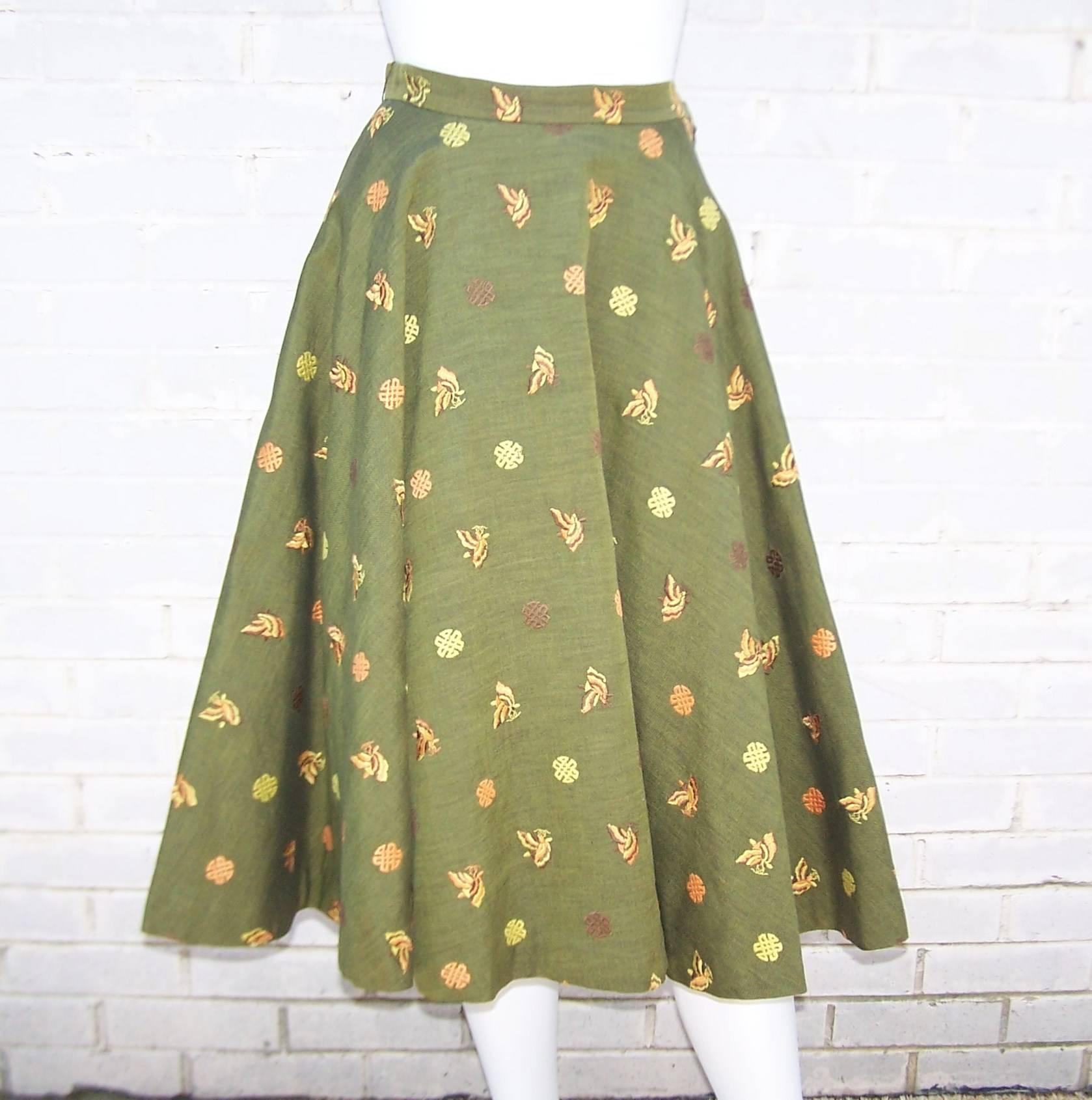 Sweet 1950's circle skirt with cinched waistband and an Asian inspired print on an army green linen blend fabric.  The skirt hooks and and zips at the side with a natural linen backing to the fabric which creates volume and weight to the skirt. 