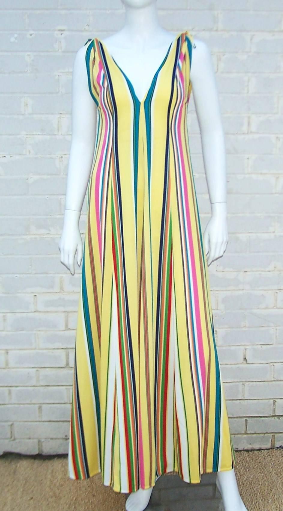 What fun!  This 1970's design by Clovis Ruffin for Keyloun is perfect for poolside, lounging or hostess wear.  The vibrant stripes and modified empire waist are a flattering combination.  The fullness of the skirt and weight of the jersey give
