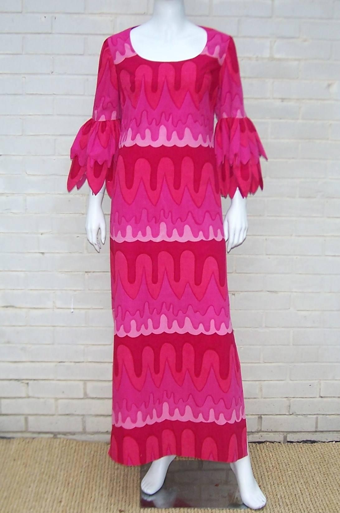 Love the petal sleeves on this vibrant 1970's maxi dress.  The dress is made of a Marimekko style fabric that zips and hooks at the back with one side slit to show a little leg.  So cute and unique...perfect for a party or any festive occasion. 